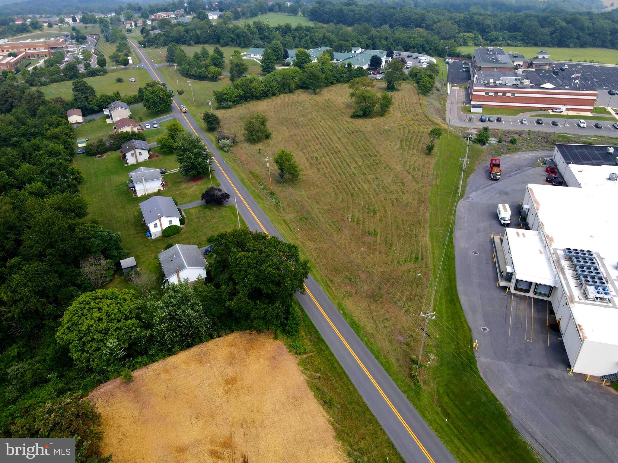 INVESTMENT OPPORTUNITY! LOCATED ON SUNRISE BOULEVARD JUST BEFORE THE HOSPITAL AND BEHIND THE LOCAL SHOPPING CENTER , IS THE 3.36 ACRES OF LAND WAITING TO BE CAPITALIZED ON WITH THE ONLY RESTRICTION BEING NO BANK/FINANCIAL INSTITUTION OR ATM. IT IS HARD TO FIND THIS MUCH COMMERCIAL LAND LOCATED IN SUCH A HIGH TRAFFIC AREA AND PRICED TO SELL! IT IS IN HUB OF HAMPSHIRE COUNTY LOCATED JUST OFF THE MAIN THOROUGHFARE FOR THOSE TRAVELING FROM VIRGINIA OR CUMBERLAND, RT 50.