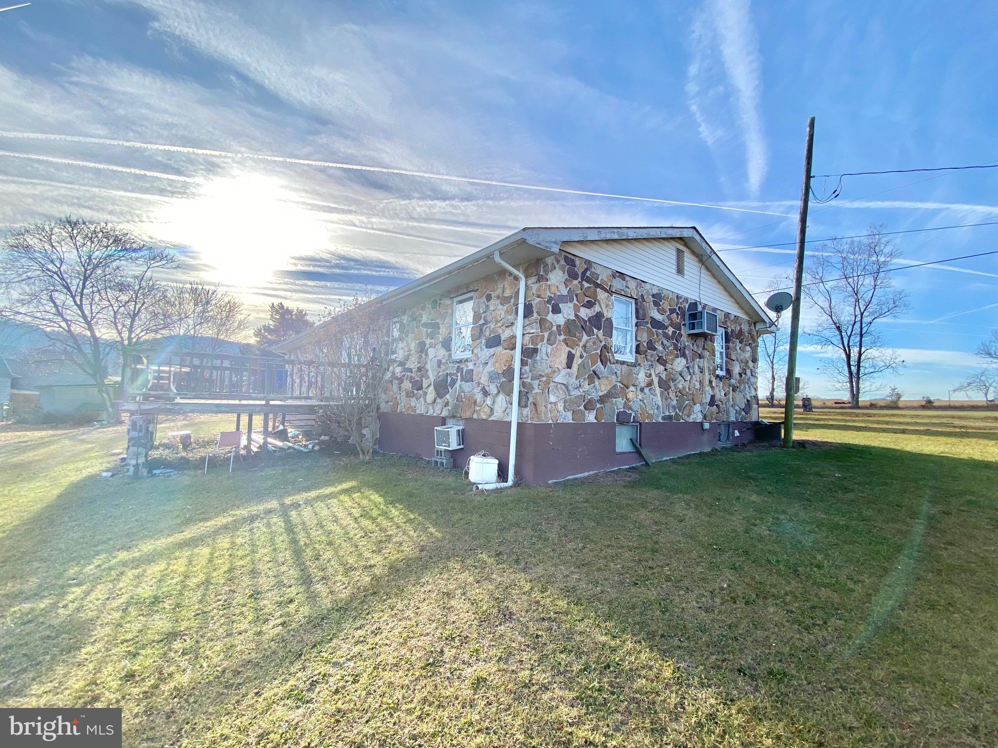 Located close to Petersburg and Corridor H, this 3 bedroom, 1 bath Rock Rancher is perched on a double lot with long range mountain views. This home also boasts 2 basement bedrooms, living room, second kitchen area and a half bath that could be easily converted into a full bath. The second lot features a large two car detached garage and plenty of yard area. Perfect starter home with a total of 5 bedrooms in case you have lots of youngins. Priced to Sell, Call Now For Your Own Private Tour!!