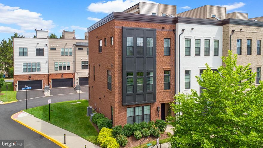 Luxurious Former Model End-Unit Townhome in Union Park at McLean.

Welcome to the premier residence in Union Park at McLean—a stunning former model home by Toll Brothers with over $264K in upgrades and designer features not available as options, perfectly positioned on the best lot in the community. This spectacular end-unit townhome combines luxury, design, and an unbeatable location with views overlooking a beautifully landscaped courtyard park.

This four-level McCarren Brandywine model offers 2,376 square feet of elevated living space, featuring 2 spacious bedrooms (plus a versatile 3rd room used as a study, bedroom or flex space), 2 full bathrooms, 3 half bathrooms, and a 2-car garage with epoxy flooring and built-in shelving.

From the moment you enter, you’ll be struck by the natural light pouring in through expansive end-unit windows and the 10-foot ceilings that create an airy, open atmosphere. Every detail has been thoughtfully upgraded—from Level 5 wide-plank wood floors throughout three levels and staircases, to custom window treatments, designer lighting, and two-zone HVAC for optimal comfort.

The main living level is ideal for entertaining, featuring a gourmet kitchen with stainless steel appliances, wall oven, gas cooktop with hood, quartz waterfall island and counters, designer tile backsplash, and ample cabinet space. The kitchen flows seamlessly into the great room, where a Cosmo fireplace with marble surround and custom built-in shelving sets the stage for cozy evenings. The dining area comfortably seats six and is accented by chic lighting and large windows.

Upstairs, the primary suite boasts a tray ceiling, a custom walk-in closet, and a spa-inspired bathroom with a double vanity, glass-enclosed shower with bench, and private water closet. A spacious secondary bedroom also features a walk-in closet and en-suite bath with upgraded tile and fixtures. A convenient laundry room is located in the hallway.

The top floor is a true showstopper—your own private rooftop retreat. Enjoy a massive rooftop terrace complete with teak wood flooring, built-in outdoor kitchen with grill and bar, gas fireplace, TV, power awning, and even green space for gardening or relaxing. With open views on three sides, it’s the ultimate setting for entertaining or unwinding under the stars.

This home is model-perfect and move-in ready, with all the luxury touches you’d expect: upgraded fixtures, custom features, and pristine condition throughout.

Location Highlights:

Top-rated McLean High School pyramid
Short walk to McLean Metro
Minutes to Tysons Corner, The Galleria, Wegmans, Whole Foods, Trader Joe’s, Safeway
Easy access to I-495, Route 66, Route 7, and the Dulles Toll Road
Close to Westwood Country Club.

This is a rare opportunity to own a truly one-of-a-kind luxury townhome in one of McLean’s most desirable communities. Don’t miss your chance to experience exceptional living in the heart of it all.