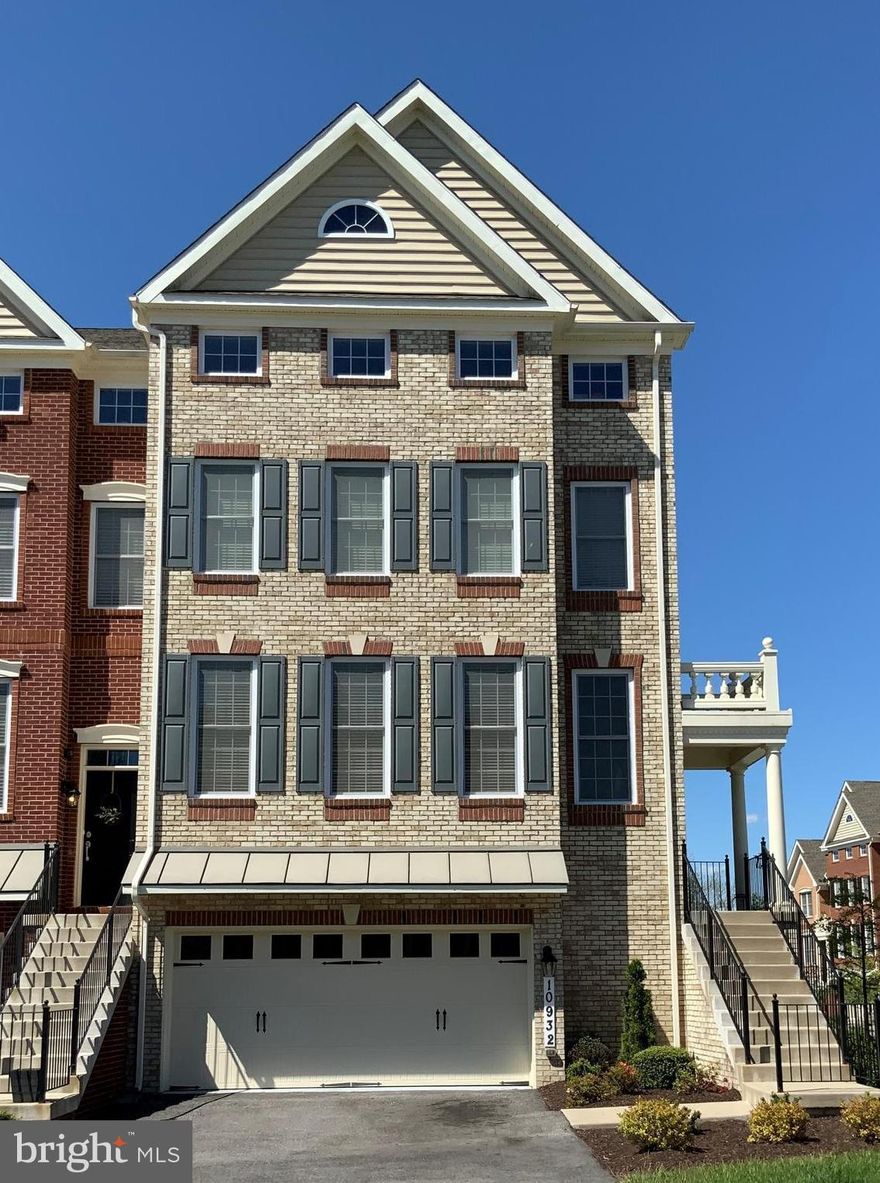 HURRY...Just Reduced to $549,999 and closing help negotiable with FULL PRICE OFFER! MARLBORO RIDGE'S LUXURY TOWNHOME (Bradbury Virginian Model...which is one of Toll Brother's largest models   4,560 Finished Sq Ft) with a 8 foot BUMPOUT and a 4th Floor LOFT!!!   Immerse in the comfort and beauty of your new home!!!  This STUNNING AND IMMACULATELY Maintained Brick End Unit Townhouse features some of Toll Brothers' Best Options in this highly sought after community Marlboro Ridge in Upper Marlboro!   Each floor is layered with upgraded amenities.  This gorgeous, well-maintained home features 2 - car garage, 3 spacious bedrooms with 3   2.5 Bathrooms! The main level features a spacious dining and living room, separated by custom columns, hardwood floors, and stairs throughout, a large gourmet kitchen with 42-inch cabinetry, 5 burner cooktop, upgraded large kitchen island, granite counter-tops,  stainless steel appliances, eat-in kitchen, an adjacent family room with a gas fireplace.  The 3 upper level offers a spacious Master Suite with a sitting room, an en suite Master Bathroom with dual vanities, upgraded tile, soaking tub, and a separate shower.  The 4th level offers a spacious loft of the entire floor featuring recess lights, skylights, and a spacious private bath.   This gorgeous home has lots of upgrades...2 inches crown molding, recess lights, upgrade tiles,  plus much more!! The exterior of this stunning home has front/side brick and a HUGE fenced in back yard.  Enjoy Marlboro Ridge Community true luxury living amenities in a unique recreational & equestrian community with clubhouse, fitness, pools, trails, Equestrian Center, and much more and just 5 minutes from the Beltway!