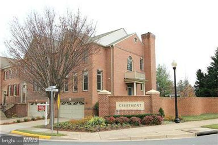 ELEGANT AND SPACIOUS Townhouse* Stately 4 Bedroom, 3 1/2 Bathroom, 2-  Car Garage W/in Walking Distance of George MasonUniversity & Fairfax County Judicial Center * Steps From Bus Transportation To Vienna Metro * 2-  Sides Brick * 3 Finished Levels w/ Large Deck &Walk-  Up LL * Walls of Windows*Hardwood ML * 2 Fireplaces *