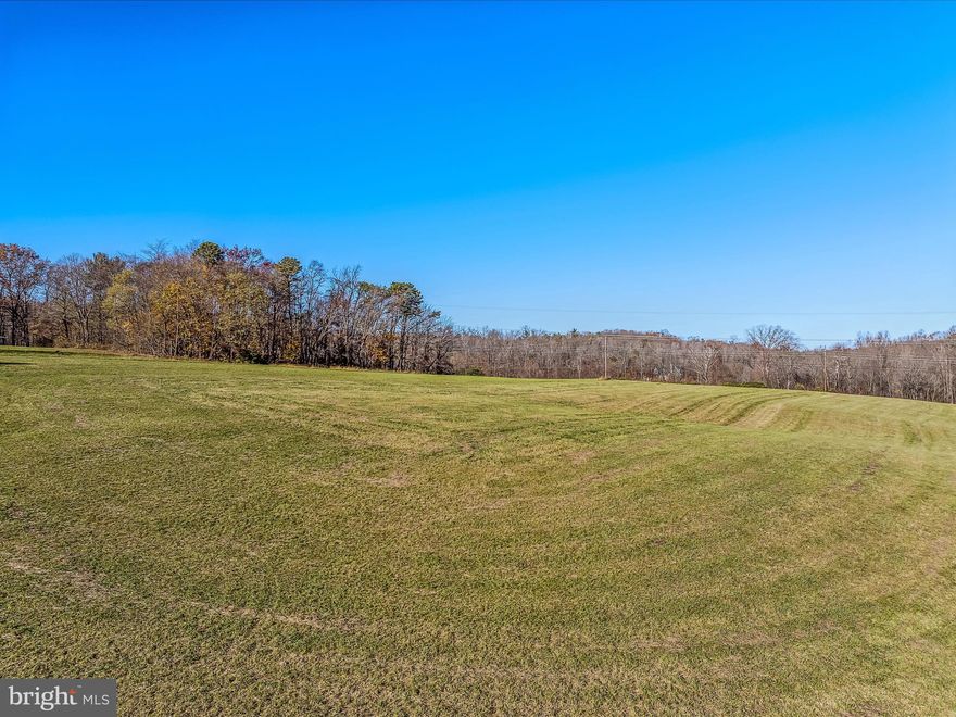 6.9896 UNRESTRICTED ACRES -  This property fronts Rt. 9 (Martinsburg Road).   This would make a great place for your new home, mobile/doublewide.   Bring your farm animals here also PLUS explore the potential of subdividing the land for multiple building sites.