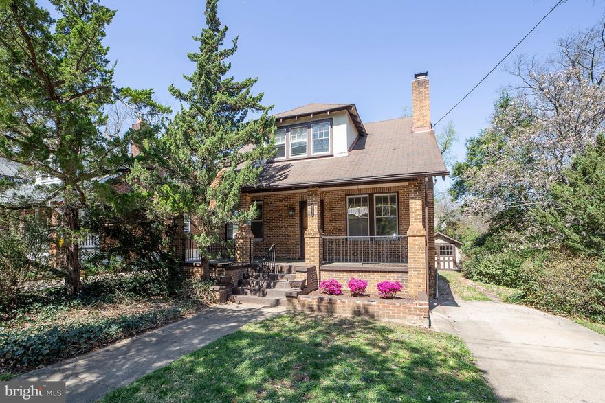 Charming and full of character, this classic University Park bungalow is ready for its next chapter! Featuring 3 bedrooms and 2 bathrooms, this home welcomes you with a wide front porch with a deep overhang—perfect for relaxing summer evenings and friendly neighborhood chats.

Step inside to discover beautifully refinished floors and a gorgeous wood-burning fireplace in the spacious living room.  (When these homes were built there were three options for this space:  the current very large living room, an archway separating and defining the area into "parlor" and living room, or building a wall and using the space for a second main level bedroom, accessed off the hall.)  The main level also includes a formal dining room, a generous kitchen, a bedroom, and a full bath. Just off the kitchen, a screened porch provides a peaceful retreat overlooking the lovely backyard.

Upstairs, a large landing area—ideal for a play space or study nook—features roomy closets for extra storage. Two comfortable bedrooms share a Jack-and-Jill bathroom, making this level both functional and inviting.

The lower level offers a large paneled room, laundry area, and plenty of storage, with a convenient walkout to the side yard. Outside, the detached one-car garage provides additional storage, and the mature plantings add interest to the backyard.

With fresh interior paint and refinished floors, this home is move-in ready—just bring your vision to add the finishing touches that will make this home YOURS.