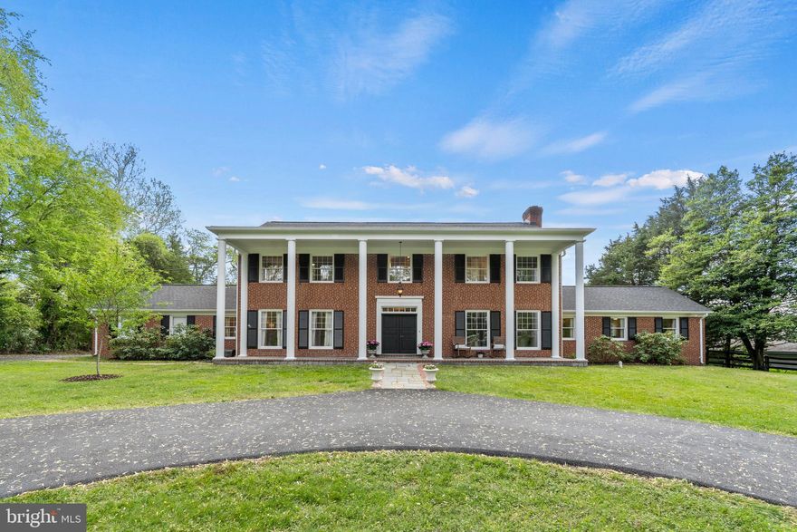 Nestled within a two-acre parklike setting, this classic 4 bedroom plus bonus room, 5-full bath center hall colonial checks every box for the buyer seeking gracious primary and private living space, work-from-home options and every amenity for enjoying the outdoors. The freshly painted interior is enhanced with newly refinished hardwood flooring, three woodburning fireplaces, and beautifully updated baths.  Formal living and dining rooms are ideal for entertaining, and the family room features an oversized fireplace, built-in cabinetry, and an expansive picture window.  The spacious kitchen adjoins a renovated breakfast/gathering room overlooking the magnificent rear grounds, where a pool, barn and four seasons of thoughtfully curated landscaping create a pastoral, storybook setting.  Designed for the leisurely lifestyle that this home offers, there is a full guest/pool bath on the main level and a large mudroom and laundry accessed by the two-car garage.  The home offers primary suites on both the main and upper level.  Tucked away privately from the day-to-day living areas, the spacious main level primary suite enjoys a beautiful bath and walk-in closets.  Upstairs there are three large bedrooms; one that includes a luxurious designer ensuite bath with an oversized curb-less shower and dual vanities. Each bedroom has ample space for furnishings and wardrobes.  Ascend the stairs to the attic level and the expansive finished space which presents so much flexibility for use: a wonderful child’s playroom; a private home office…even an artist’s studio.  The walk-up lower level has a full kitchen with granite countertops and stainless steel appliances, brand new luxury vinyl flooring throughout, a large recreation room with wood-burning fireplace and a sizeable bonus room and updated bath. Step outside to a wonderful and private paradise, where a pool invites laps and languishing on a warm day, a large lawn expanse is the perfect ballfield, fruit trees to enjoy freshly picked peaches and pears, and a barn adds the finishing touch to this quintessential town-and-country home.  From the newly paved circular driveway to the inviting resurfaced pool, this property offers turn-key living within a setting of unrivaled natural beauty. This perfect oasis is located in the top-rated Wootton High School district and minutes to shopping, restaurants and major commuter routes. **Tax record square footage does not include breakfast and bathroom addition or finished attic.**