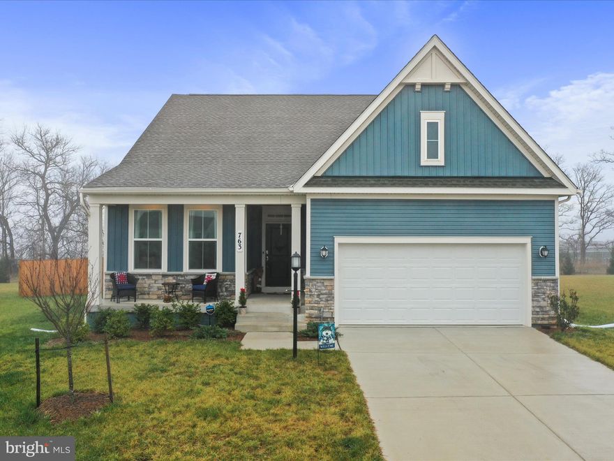 **Today's Open House has been cancelled due to weather and the anticipated unsafe driving conditions. Thank you for your understanding!** 
         The convenience of a brand new home, in a terrific neighborhood, with a community pool, but you do not have to wait for the builder to finish!! Seller can move quickly if needed!
The front porch is perfect for chatting with neighbors as they pass by, go trick-or-treating, play-time in the front yard with the rest of the neighbors, and decorating for all of the holidays. 
Inside, this property is beautiful, super clean, and ready for its next owner to make it their own. A terrific layout gives space for all to gather as well as providing privacy in the three bedrooms that are spaced apart nicely. The kitchen is a perfect chef's kitchen, with stainless steel appliances, and a super quiet Bosch dishwasher. The granite countertops and soft gray shaker cabinets go together perfectly! Homework, dinner, crafts, you name it, can be done in the table-space area while meals and snacks are prepared and while entertaining in the open living room.
The lower level boasts a large living area, a large bedroom, and a full bath that makes it perfect for multi-generational living or more entertaining. There is a rough-in for a wet bar and a ton of storage area to make it an even larger and multi-faceted space!
The rear yard is backed up to a solar field which means you will never have neighbors behind you! There will always be a view of the stunning ridges surrounding our area. The back yard is flat, grassy, fully-fenced, and ready for fur babies and your outdoor oasis ideas!
This community has what many wish they had-a swimming pool for those hot summer days!! There are sidewalks everywhere for walking, biking, running, scootering, skipping, you name it. It is perfectly located for shopping, restaurants, County offices, commuting to Maryland and Virginia, as well as to all of the amazing outdoor recreational activities that are local as well as the ones that are not too far like battlegrounds, historical towns, wineries, breweries, loads of river fun, and hiking trails of all difficulties. 
Lastly, but definitely not least, is the proximity of this neighborhood to not one, but TWO, huge metropolitan areas, Baltimore, MD and Washington, DC. There are even commuter trains to take you into these towns located within 15 minutes of your front door! 
This is a perfect house, with a perfect lot, with perfect amenities! Come see it today!