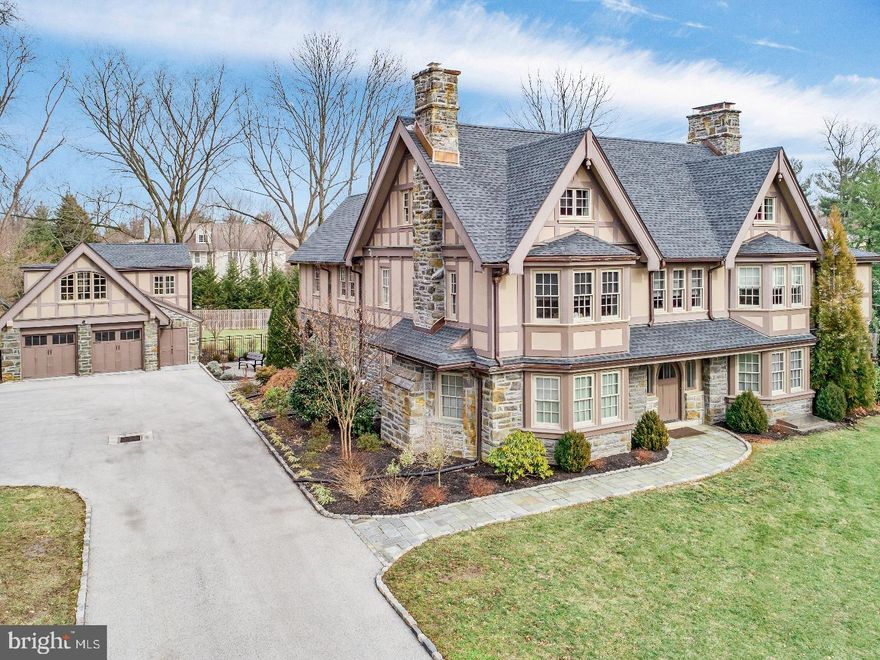 Welcome to 321 Old Gulph Road. This beautiful modern Tudor sits on a picturesque .87 acres in the highly desired Lower Merion Township. Thanks to a recent renovation, this home and its Carriage House offer a unique blend of preserved period features and today's desired updates. As you enter the home serenity will take hold of you. From the nuanced color palette on the walls; the warm, rich tone of the hardwood floors; and the crisp whites on the handcrafted woodwork that flow throughout the home- every design element highlights the homes' original craftsmanship and compliments its modern amenities. A gracious foyer will greet you, flanked on either side by a generous dining room and living room, each featuring a gorgeous fireplace and a sweeping bay window with built-in seating. The dual French doors off the living room will lead you to a sunk-in multi-use room perfect for a den, study, playroom, and more! The French doors in the kitchen lead to a beautiful slate patio and the pool. The custom kitchen is complete with an oversize island, a wet bar with ice cooler & wine cooler for your entertaining needs, an abundance of cabinetry, Wolf range & ovens, a 48 in. Sub-Zero refrigerator, and other high-end appliances. Just off the kitchen you'll find a mudroom with a 2nd laundry area convenient to the pool. The sunlit staircase leads to a perfectly appointed upper level. The stunning master suite includes a fireplace, bay window with seating, a dreamy custom his & hers closet, and an updated master bath. Three additional generous bedrooms, a Jack-and-Jill bath, a full bath, and a laundry room round out the upper level. The third level hosts 2 bedrooms (perfect for a "mom-cave," craft room, playroom, or guest suite) and a full bath. The spacious finished lower level offers room for everyone and includes a partial bath. Just when you thought this home couldn't offer any more luxury living, the Carriage House stuns with a bedroom, full bath, and kitchen. This unique space is ideal for a guest or au pair suite, studio, or home office. This home offers the complete package and is sure to wow you and your guests for years to come.