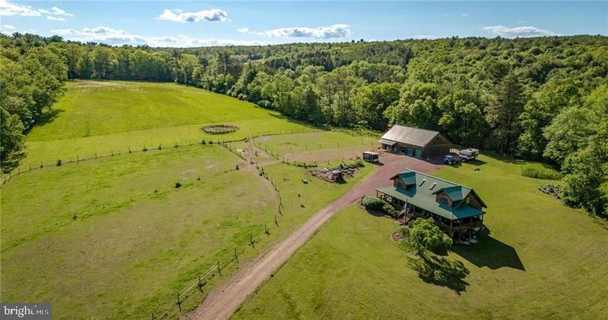Welcome to this upscale Family estate and equestrian property you've been searching for!  Perfectly private and secluded this 34 acre farm features tillable land, lush hay fields & wooded land for the hunter.  Amazingly updated log home with vaulted ceilings and second floor loft.  Main floor gourmet kitchen with stainless appliances, separate dining room area and open concept living room.  First floor Master Suite with large walk in closet and updated full bathroom.  Master Suite has direct private access to wrap around porch and a luxurious hot tub waiting for you.  Laundry room and half bathroom complete the main floor.  2nd floor offers 2 nice sized bedrooms, both having walk in closets, loft area and 2nd full bathroom.  Lower level walkout basement features wide open canvas for additional living space and storage.  Outdoors feature spacious barn with 3 horse stalls, heated tack room, laundry area and half bathroom.  2nd floor hay storage in addition to 2nd floor 1 bedroom updated apartment providing additional rental income or extended family space.  4 indoor garage bays in addition to 4 equipment storage bays in the rear of the barn.  Approx. 10 acres of lush hay fields and 2 separate horse pastures as well as a round pen for training horses.  Mature fruit trees and raised garden beds along with a chicken coop and run for the Gentleman Farmer!  Amazing 360 views from your covered wrap around porch, this is a dream home!  Call for your private showing today!