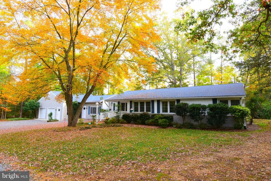 This home has had many renovations &  large garage addition.  Windows & siding in 2002., roof in 2013, AC in 2012, Furnace in 2010. Remodeled kitchen & baths.  Hardwood floors.  Efficiency apartment or home office with separate entrance. 30 x 24 garage & 18x15 shop, both have insulated walls & gas heat.  Main house has oil furnace.  Gas cooking, gas fireplace. 2 decks.  Private back yard.