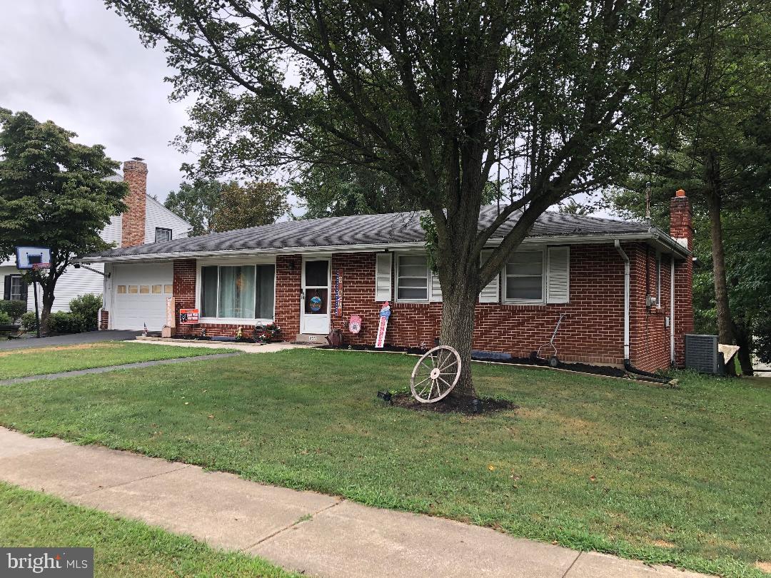 OFFER RECEIVED Seller has set a deadline for all offers at 5:00 Sunday August 31st. Great location for this 3 bedroom 2 bath brick ranch close to hospitals, schools, shops and more. Features include living room with hardwood floors and large picture window offering plenty of light, and a wood burning fireplace in partially finished walkout lower level, full bath, laundry room and more. Carport converted to 3 season room or garage. Large rear yard. Home being sold in as is condition. Seller reserves right to accept offer at any time