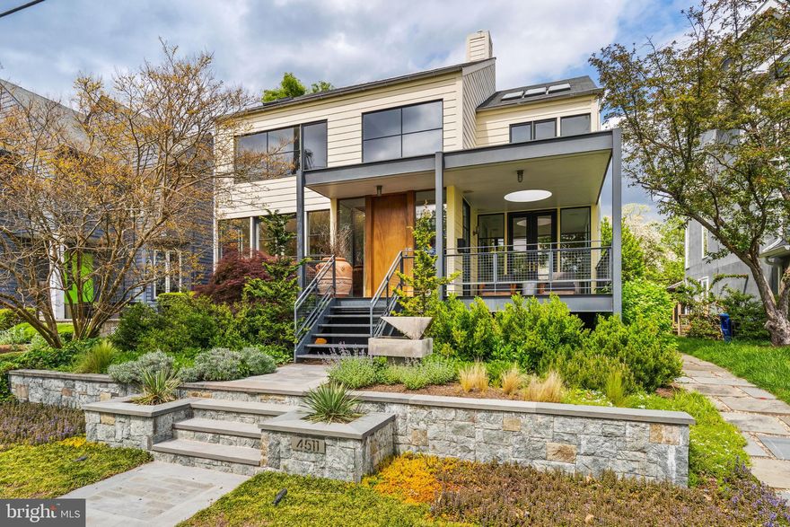 This stunning contemporary home, designed by the renowned architect Robert Gurney, isn't just a place to live — it's an experience. Imagine waking up to sweeping views of the Potomac River from your bedroom window, cozy evenings by the fireplace on the screened-in porch, or summer barbecues with friends while the sun sets over the water. Don't miss the private hot tub for added convenience. 
Gurney's vision for light-filled spaces comes to life here, with floor-to-ceiling windows bathing the interior in natural light and framing a breathtaking view of the Potomac River. The master suite offers a private sanctuary with its own river views, while the high-end kitchen practically begs you to whip up culinary masterpieces.
Beyond the luxurious interior, this home prioritizes comfort and convenience. Enjoy year-round climate control with a brand-new HVAC system. The downstairs laundry has been completely remodeled for added convenience. The home's exterior features elegant new hardscaping, creating a beautiful first impression. For added convenience, an in-home elevator offers accessibility, and a private garage keeps your vehicles secure.
Nestled in a peaceful, green enclave, this home offers a quiet escape in the Palisades from the city bustle. Yet, it maintains easy access to everything Washington D.C. has to offer. Virginia and Maryland are also close by, providing even more options for dining, entertainment, and exploration.
This isn't just a house; it's a lifestyle. Experience the perfect blend of modern design, unparalleled views, and convenient living at 4511 Potomac Ave NW.