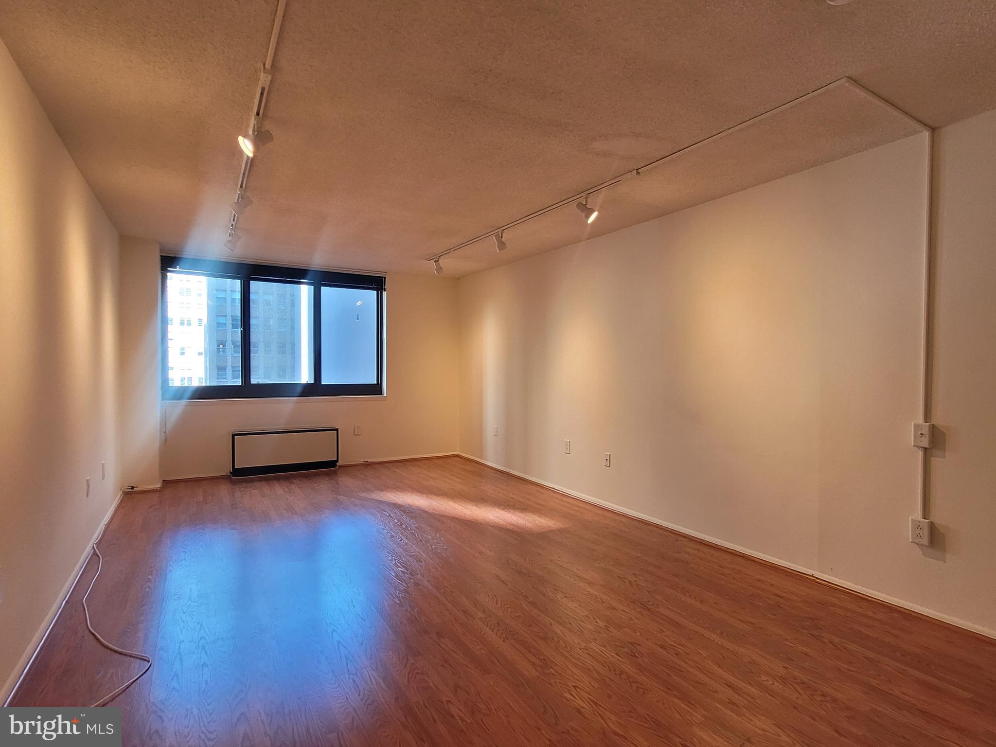 Spacious one bedroom showcasing city views and hardwood floors throughout! Expansive one bedroom, one bathroom with great entertaining space and lots of natural light. Enter through a foyer into the generously combined living and dining room. This room features oversized windows offering northern city vistas and ample space for separate living and dining areas. Adjacent, there is a perfectly sized kitchen with white cabinetry, gray countertops and white appliances. The spacious bedroom enjoys more oversized windows, excellent closet space and a full hall bathroom with a large single vanity and shower/tub combination. The bathroom also provides access to a stackable washer/dryer. Residents of Academy House enjoy a 24-hour doorman and a state-of-the-art fitness and aquatic center. There is valet parking in the building's garage for an additional monthly fee, subject to availability. The Academy House is located in the heart of Center City and within close walking distance to Rittenhouse Square, Washington Square, and the Broad Street and Market Street office corridors. The Philadelphia International Airport and Amtrak's 30th Street Station are easily accessible.