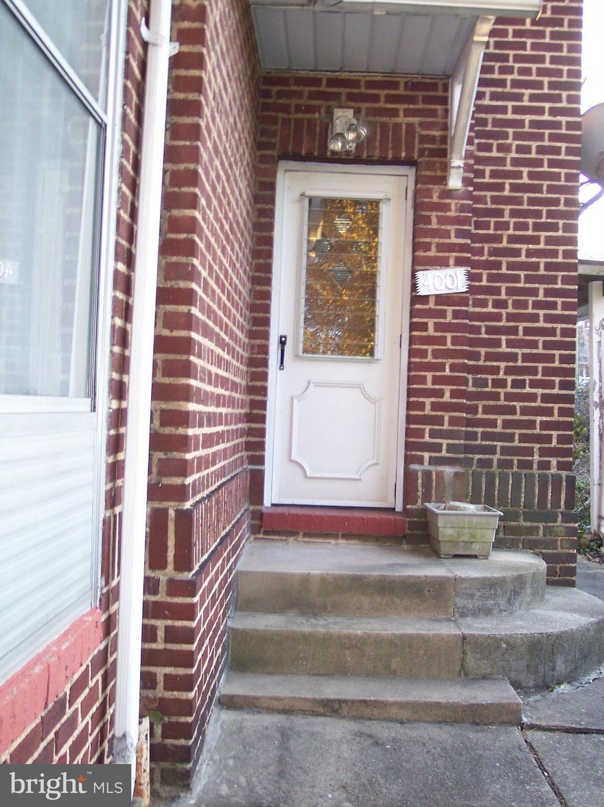 Charming brick home with slate roof. A fireplace to snuggle around on cold nights. Large yard in private location, but close to everything.at the city/county line. Updates include windows and water heater. Deck to enjoy in nice weather. Covered carport and detached garage.Might be able to sub-divide lot.