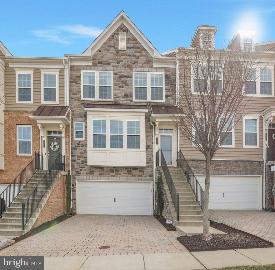 OPEN HOUSE - SUNDAY 1-3 PM. Welcome to luxury living at its finest! This stunning 2016 built Pulte townhome is a rare find in the exclusive subdivision of Wincopia Farms in Howard County, MD. Prepare to be wowed by over 2,500 finished square feet of pure luxury. With brand new painting, carpet, and hardwood throughout, this home is truly turnkey and ready for you to move right in.

As you approach this magnificent home, you'll be greeted by a stacked brick exterior and a covered portico, setting the stage for the elegance that awaits inside. With 4 bedrooms and 4 bathrooms (2 full and 2 half), this townhome offers plenty of space for the whole family. The sun-drenched main level features gleaming hardwood floors and an open concept that is perfect for entertaining.

The heart of this home is the fabulous gourmet gas kitchen. Featuring 42" classic white cabinets, high-end stainless steel appliances, and a supersized granite island, this kitchen is a chef's dream. The sleek stainless steel gas range with 2 ovens, spacious pantry, and customized backsplash are just a few of the many luxurious touches. Adjacent to the kitchen is a sun-drenched sunroom with a custom built-in office, upgraded granite, and 42" white cabinetry.

Step out onto your private deck oasis and enjoy grilling or a morning cup of coffee or tea. The gas line for your grill is an added bonus. The family room is highlighted by an elegant deep blue-green accent wall with a custom wood design, creating a visually stunning space. A half bathroom is conveniently located on the stairway for ultimate privacy.

As you make your way upstairs, you'll find the spacious owner's suite. This retreat features luxury tray ceilings, a massive walk-in closet system, and a luxurious en-suite bathroom complete with a massive shower and upgraded stone countertop. Two additional spacious bedrooms, a second full bathroom, and a convenient laundry room complete the second level.

The lower level of this home offers even more space to relax and unwind. The sun-drenched den/recreation room features brand new carpet and a fresh coat of paint, while the fourth bedroom offers access to your private patio and boasts a trendy barn door entry. The half bathroom completes this level.

No luxury home would be complete without an oversized, finished, and upgraded 2-car garage — complete with an insulated garage door, ceiling storage racks and a work station, this garage is every car enthusiast's dream.

Convenience is key with this home's location. Minutes from shops, restaurants, and major commuting routes, you'll have easy access to Ft. Meade, Columbia, Baltimore, and Washington DC. Plus, enjoy the benefits of being in the top-ranked Howard County school district, complete with a private underground tunnel connecting to Gorman Crossing Elementary and Murray Hill Middle School. The Wincopia Farms' massive playground is under construction and set to be completed April of this year!  ** HVAC TUNED UP! 

Don't miss out on this incredible opportunity to call this like-new, luxury townhome your own. This home won't last long, so schedule your private showing today!