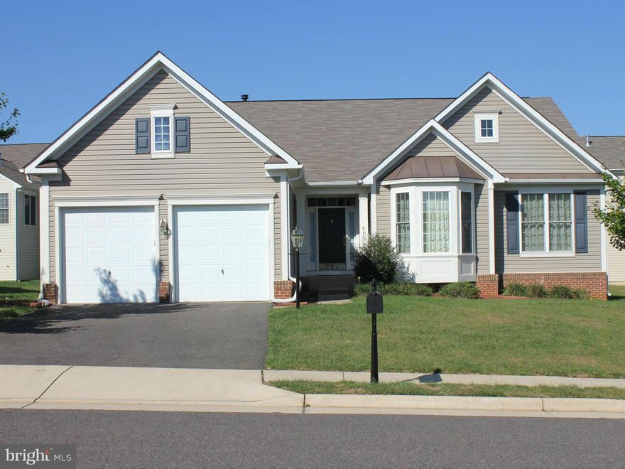 JUST REDUCED! Beautiful Rambler Shows Like New! One Level Living at it's Finest.  Home is Open and Inviting.  Amenities: 9' Ceilings, Vaulted Ceilings In MBR & LR, Granite Kitchen Counters, 42" Cabinets, Bays, Stone FP in LR.  Master Bath Features Double Sinks, Jacuzzi Tub, Separate Shower. Basement recently finished with RR, Den/Office, FBA, Storage.