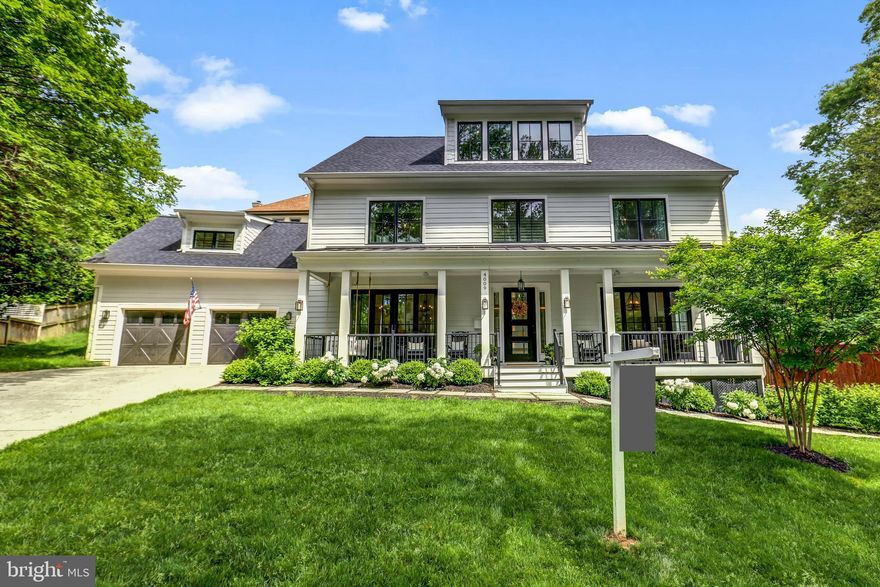 Constructed in 2019, this exceptional 6 bedroom, 6.5 bathroom craftsman-colonial home spans over 7,000 sq ft and is located on a tranquil street in the sought-after Cherrydale neighborhood of Arlington. The main level of the home is an entertainer’s dream, featuring sliding doors that connect the living spaces seamlessly with a large front porch and a sprawling 600 sq ft flagstone back patio. The chef’s kitchen is equipped with a butler’s pantry, two wine fridges, and leads into an open-plan living area. The main level includes a light-filled office with sliding doors that access the front porch.  Each of the four bedrooms on the second level boasts an en-suite bathroom, enhancing privacy and convenience. A large laundry room adds to the functional layout of this floor. This residence is notable for its expansive loft — one of the largest in Arlington — encompassing over 1,200 sq ft of versatile space on the third level. It includes a sizable play area or teenage hangout space, a bedroom, a full bathroom, and large windows that flood the space with natural light. The basement is well-appointed with a gym, an additional bedroom, a wine/beverage fridge, a kitchenette, a full bathroom, and direct access to the front yard. The property sits on an 11,851 sq ft lot and features beautiful, mature landscaping that includes crepe myrtles, a cherry tree, hydrangeas, peonies, dogwoods, roses, and more, all encompassed by a newly-added professional landscaping package. Additional luxury upgrades include an added flagstone retaining wall and fence, designer lighting fixtures, and custom window treatments. Further enhancing this stunning property are the practical and aesthetic upgrades such as a gas line for a grill and potential firepit, epoxy-coated garage floors, built-in shelving in the garage and basement, a swing on the spacious front porch, and multiple fans enhancing the outdoor living experience. It is perfectly positioned between the areas of Donaldson Run and Cherrydale, providing convenient and nearby access to a plethora of amenities and schools including Dorothy Hamm Middle School, a local farmers market, Cherrydale Park, Cherrydale Library, Windy Run, Lee Heights Shops, Safeway, and Dunkin Donuts. The house is close to D.C.—only a 5-minute drive to the Key Bridge. This meticulously cared-for home offers both the charm of suburban living and the convenience of city living, making it a truly rare find in Arlington. Come tour this gem!