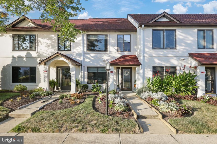 Lovely 2 bedroom 2.5 bath renovated townhome located in the community of Queens Landing. Large living room with corner fireplace, newer flooring throughout. Second level features 2 spacious bedrooms, each with their own full bath and laundry conveniently located in hall. Private patio with beautiful water views.  New HVAC, roof, and appliances. Amazing community amenities including outdoor pool, tennis & racquetball courts, fitness center and more! Close to restaurants, shopping and the Kent Island walking trail.