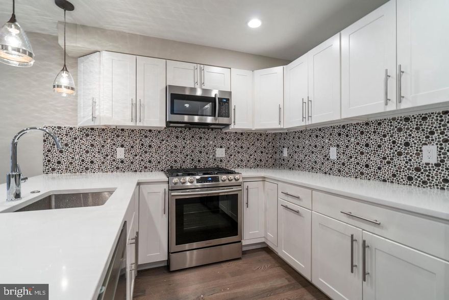 OPEN HOUSE THIS SATURDAY 7/16/22 from 2:00 PM - 3:30 PM. Gorgeous Bi-Level 3 Bed, 3 Bath unit in Graduate Hospital with tons of natural sunlight and a stunning kitchen complete with quartz countertops and stainless steel appliances. Huge living room with open floor plan and a large rear yard with enough room for entertaining. The first floor is complete with your 1st bedroom including full hallway bathroom. On the lower level you will find your generously sized 2nd and 3rd bedrooms one with an ensuite bathroom and the other is a hallway bathroom. Just a few blocks from Rittenhouse Square, one block off south street, and walking distance to entertainment, shopping and transportation. Don't miss this one!