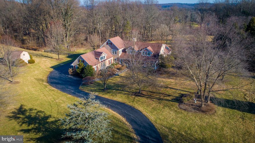 Welcome to 1811 Horseshoe Trail; a custom built home in the heart of beautiful Chester Springs, surrounded by 90+ acres of preserved land. This custom 6,000 square foot home was built by Diament Builders. It features 4 bedrooms, 2.5 bathrooms, an open concept kitchen and dining area with a double sided stone fireplace, large living room, family room, formal dining room, office space and a spacious sun room. Highlights of the property include the exquisitely designed and completely private pool, spa, back patio/pool patio, and large backyard which could easily accommodate your favorite horse or pony. Come see this beautiful property for yourself and find the space and tranquility you’re looking for in todays hectic world!