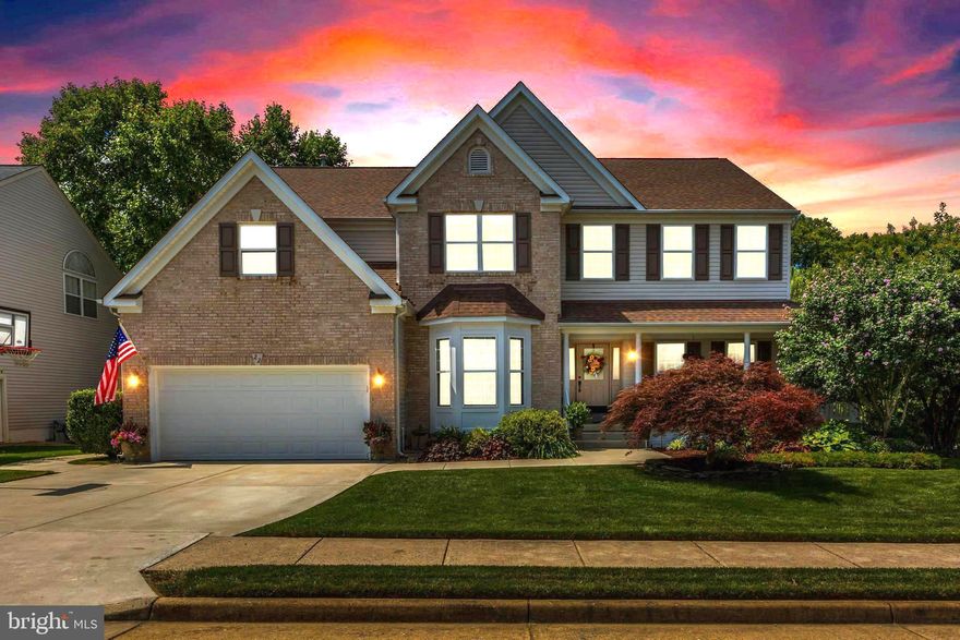 The perfect blend of sophistication and comfort, this 6 bedroom (including one on the main level),  5 bathroom Colonial has been meticulously updated and maintained by its owners since 2012.   Located in popular Austin Ridge subdivision on a private .27acre lot backing to trees and surrounded by green space on 2 sides!   A brick and vinyl exterior, impressive landscaping, and welcoming front porch establish wonderful curb appeal.   Inside, beautiful hardwood flooring and a soaring cathedral ceiling create a spacious ambiance.   Appointments including tray ceilings,  crown molding,  bay windows, upgraded countertops and flooring emanate quality throughout the home.   The gourmet kitchen is a chef's delight with a 5-burner gas cooktop, double wall ovens, French door refrigerator with lower drawer freezer,  spacious walk-in pantry, and abundant prep space!  Granite countertops, custom backsplash, white cabinetry, stainless appliances, generous island, and separate desk workspace provide a pleasing aesthetic!   Meals can be enjoyed in the light-filled breakfast room enveloped by bay windows or in a formal dining room setting.   An adjacent family room featuring  a soaring cathedral ceiling, wall of windows, and cozy fireplace creates the perfect environment for spending time with friends and family.   An elegant dining room appointed with crown molding, tray ceiling, gorgeous lighting fixture, and bay window elevates entertainment and opens to a comfortable living room.   Ideal for guests or for multi-generational living, a main level bedroom with attached full bathroom offers the perfect solution!   A beautiful wooden staircase leads to the upper level where an expansive primary bedroom awaits, complete with 2 closets, tray ceiling,  and an impressively updated en-suite bath.  This spa-like retreat features a soaking tub, frameless shower, dual sinks, granite countertops, and upgraded tile flooring and shower surround.  There are 3 additional, generously-sized bedrooms upstairs, one with an impressive walk-in closet!  A Jack-n-Jill bath with private tub/shower and toilet area features dual sinks to accommodate morning and evening routines while an en-suite bath with a granite countertop services the 3rd bedroom!   Completing the upper level is a flex space overlooking the 2-story family room; a perfect play, reading, or hang-out area!  A wall of closets serves all storage needs!   Want to spread out or perfectly accommodate a guest?  The lower level offers a spacious recreation room with a walk-out exit plus a bedroom with full bathroom access!  Storage is plentiful with a generous unfinished area available to provide a place for every belonging!   Outdoors, a peaceful oasis has been created!  Enjoy the lush green yard (assisted by an irrigation system) and professional landscaping from the composite deck or concrete patio!  Privacy is ensured by the green space located beside and behind the property and there is nearby access to the community walking trail!   Functionally, the home offers equal quality and is ready for years of enjoyment!  Improvements include: new roof 2017, new TRANE HVAC systems 2024 and 2020,  15 new low-e, double hung windows and 1 door 2023,  new water heater 2021,  Deck replaced with composite material 2020,  Baths updated 2020,  Concrete driveway replaced 2018,  and basement finished in 2016.    Additionally,  all flooring and appliances have been updated and blinds added (including solar operated ones in family room) since 2012.    Austin Ridge is a highly desired, amenity-filled community offering an outdoor pool, tennis courts, playground, and walking trails.  Conveniently located for commuter travel near major interstates, ride-share, and VRE.  Shopping, restaurants, Quantico, Stafford Hospital, and historic Fredericksburg are easily accessible.  Top-rated Stafford County schools.  Come see all that this wonderful home and community have to offer!
