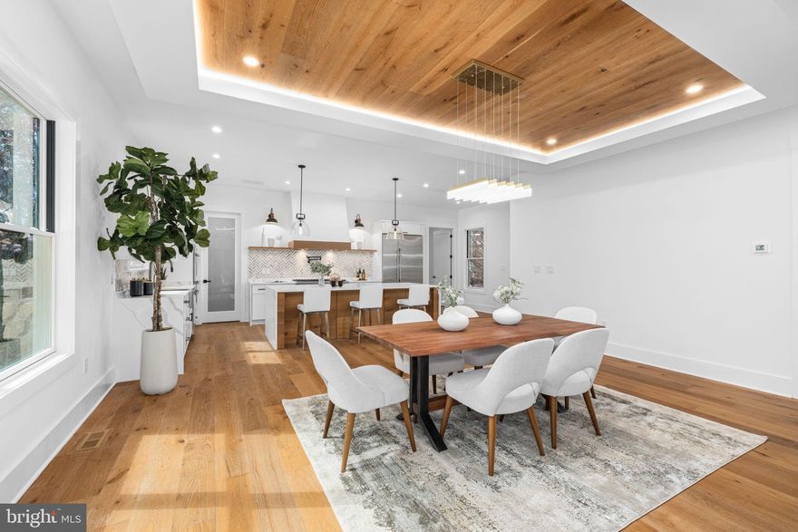 Welcome to your luxurious retreat in the highly coveted Westover/Fostoria neighborhood with Cardinal/Swanson/Yorktown School pyramid!! Step into this stunning brand new construction that is flooded with natural light and boasting 6 bedroom, 6.5 baths with a 3rd upper level that really shines! Open and bright floor plan with a thoughtful design includes everything you need: elevator ready for access from garage to all levels including the 3rd level; main level bedroom/office with full bathroom; chef's kitchen with oversized quartz waterfall island with abundant seating and under counter storage; gorgeous wide plank hardwood flooring throughout ALL levels; and quality craftsmanship throughout. Special features include: metal roof; gorgeous exterior stone; beautiful tray ceiling in the family room; cove lighting & wood ceiling detail in the dining area; custom vanities and beautiful bathroom tiling. The primary bedroom is a show stopper with a spacious suite featuring two walk-in closets and an incredible spa-like primary bathroom with his and hers vanities featuring dimmable LED backlit mirrors with anti-fog. Unwind in an oversized resin soaking tub,  perched in a luxurious custom glass shower with dual rain shower heads. 
The basement features: a mudroom with custom built-ins for convenience right off the garage entrance; a lounge area and plenty of space for gaming; a wet bar with a beautiful backsplash and open shelving and under counter beverage fridges and a chic wine display wall with back lighting. This sought after North Arlington location is truly incredible. Just blocks to Westover Village, Westover Market, restaurants, and shops. 0.2 miles to Cardinal Elementary and 0.6 miles to Swanson Middle School. Less than a mile to East Falls Church Metro! Location simply can’t be beat!