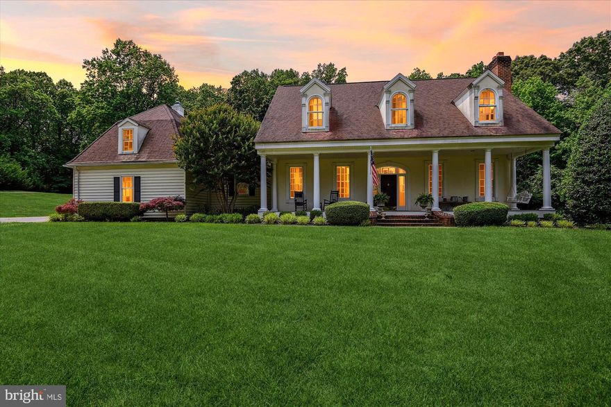 Southern Living Style Custom Home on 1.45 Acres in Annapolis

Step into timeless charm and craftsmanship with this stunning William Poole Design Southern Living-style custom home, nestled on a 1.45-acre private, level lot backing to trees. From the moment you arrive, you’re welcomed by a large, inviting front porch—perfect for relaxing and enjoying the peaceful surroundings.

Inside, the home exudes warmth and elegance with wide plank heart of pine flooring throughout the main level, 10-foot ceilings, and custom millwork including board-and-batten trim work, wide baseboards, wide crown moldings, and cathedral ceilings.

The formal foyer greets guests with grace and sophistication. To the right, you’ll find the formal living room, complete with a masonry wood-burning fireplace and ample natural light. On the left is a private formal dining room, ideal for hosting special gatherings.

Continue through to the heart of the home—an impressive gourmet kitchen featuring upgraded stainless steel appliances, dual wall ovens, 2-drawer dishwasher,  and a large center island with induction cooktop. The kitchen also includes a coffee bar and is adorned with stunning leathered quartzite countertops. A charming breakfast nook with an exposed antique brick accent wall adds character and comfort. Off the kitchen is a spacious utility/laundry room with built-in cabinetry and access to a brick/stone patio—perfect for outdoor entertaining.

The sun-drenched family room boasts vaulted ceilings and a antique brick wood burning fireplace wall, creating a cozy yet open atmosphere. A convenient powder room is just off the family room.
The main-level primary suite offers a private retreat with plantation shutters, built-ins, an en suite bathroom with jetted tub and separate shower, and walk-out access to the rear deck overlooking your private backyard oasis.

Dual staircases accessing upstairs, discover a second family room, separate office, workout room with antique brick wall, plus three additional bedrooms and two full bathrooms, providing plenty of space for family or guests.

The 2100+ square foot unfinished, walkout basement with fireplace and rough-in has plenty of room for your creative design and/or ample storage space.  

Located just minutes from the South River and Chesapeake Bay, and at the center of Annapolis' renowned dining, shopping, and waterfront lifestyle, this is a rare opportunity to own a truly unique, custom-built home with character, space, and unbeatable charm.

Don’t miss out—schedule your private tour today!