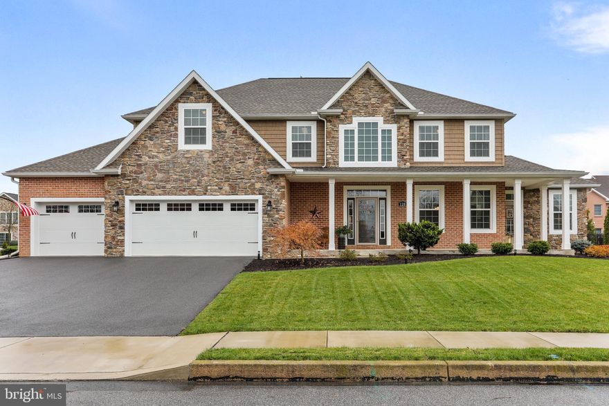 The home you have been waiting for! This impressive home in Heritage Estates features an exterior with stone, brick, and shake vinyl. The kitchen has custom hickory cabinets by Hess, granite countertops, and ceramic flooring. The home includes hardwood flooring, crown molding, chair rails, and the family room has an inviting stone fireplace with gas logs. The hardwood staircase leads to the four spacious bedrooms with a  19 x 17-foot master bedroom with two walk-in closets and a very spacious master bathroom with a large glass-enclosed shower and soaking tub perfect after a long day. The fenced back yard with patio is the finishing touches to this impressive home! This is a true must see home!