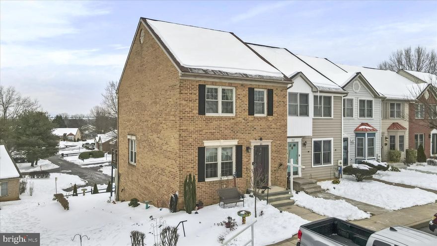 Beautiful End-Unit Townhome with Deck, Fireplace & Walkout Patio and  3 Finished Levels.  Welcome home to this spacious end-unit townhome offering 3 bedroom, 3.5 bathrooms and a bright open layout on main level designed for comfortable living.  The main level features and open living room/dining area with hardwood floors and a brand-new sliding glass door that fill the space with natural light.  "Sliding glass door leads from the living room to a sunny deck--your new favorite coffee spot." Half bath on main level. The kitchen is both stylish and functional with granite countertops, farmers sink, tile flooring, island and pantry.  The kitchen offers a butler's window that is perfect for entertaining.  Upstairs, you'll find a large primary suite with private bath and the convenience of upper-level laundry.  2 bedrooms plus second  bathroom.  The lower level walkout offers versatile living space with  built in book shelves,  propane gas fireplace for those comfy winter evenings, full bath, utility room and access to a  concrete patio  ideal for relaxing or hosting  guests.  As an end unit, this home enjoys added privacy and extra light throughout.  A perfect blend of space, updates including a new Architechual Roof, New HVAC (Trane)  new Water Heater in 2024,  refrigerator in 2023 and sliding glass door has  been replaced.  There is a friendly cat that lives in the home.