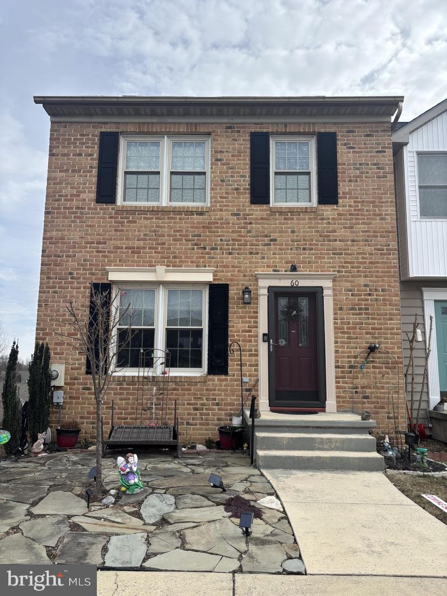 Beautiful End-Unit Townhome with Deck, Fireplace & Walkout Patio and  3 Finished Levels.  Welcome home to this spacious end-unit townhome offering 3 bedroom, 3.5 bathrooms and a bright open layout on main level designed for comfortable living.  The main level features and open living room/dining area with hardwood floors and a brand-new sliding glass door that fill the space with natural light.  "Sliding glass door leads from the living room to a sunny deck--your new favorite coffee spot." Half bath on main level. The kitchen is both stylish and functional with granite countertops, farmers sink, tile flooring, island and pantry.  The kitchen offers a butler's window that is perfect for entertaining.  Upstairs, you'll find a large primary suite with private bath and the convenience of upper-level laundry.  2 bedrooms plus second  bathroom.  The lower level walkout offers versatile living space with  built in book shelves,  propane gas fireplace for those comfy winter evenings, full bath, utility room and access to a  concrete patio  ideal for relaxing or hosting  guests.  As an end unit, this home enjoys added privacy and extra light throughout.  A perfect blend of space, updates including a new Architechual Roof, New HVAC (Trane)  new Water Heater in 2024,  refrigerator in 2023 and sliding glass door has  been replaced.  There is a friendly cat that lives in the home.