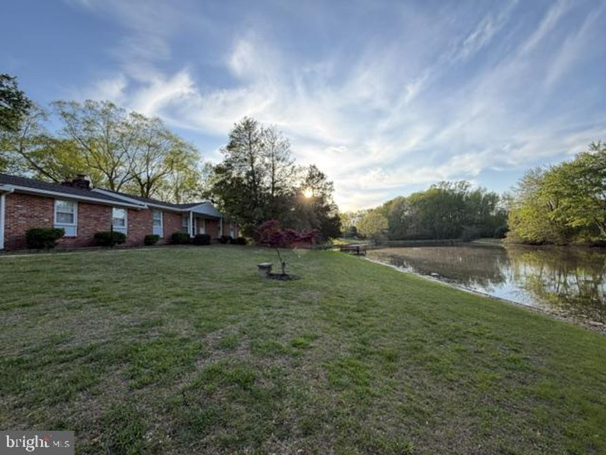 This exquisite ranch-style home offers a unique blend of luxury and tranquility, perfectly complemented by its stunning water features. Spanning over 2.41 acres, this property boasts an impressive 302 feet of private pond frontage, creating an idyllic backdrop for both relaxation and recreation. As you approach the home, the charming brick and vinyl siding exterior invites you in, hinting at the warmth and comfort that awaits inside. The spacious layout encompasses three well-appointed bedrooms and two full bathrooms, providing ample space for both entertaining and unwinding. The heart of the home features two inviting fireplaces, perfect for cozy evenings spent with loved ones, while the expansive living areas in the sunroom and rec room seamlessly connect to the outdoor spaces, allowing for effortless indoor-outdoor living. Step outside to discover your own private oasis. The tranquil pond not only enhances the beauty of the landscape but also offers a wealth of recreational opportunities. Enjoy leisurely afternoons fishing from your private dock or embark on peaceful canoe and kayak adventures, all just steps from your door. The gentle sounds of water lapping against the shore create a soothing ambiance, making this property a true retreat from the hustle and bustle of everyday life. The expansive lot provides plenty of room for pets and outdoor gatherings, whether it's a summer barbecue or a quiet evening under the stars. Imagine sipping your favorite beverage on the gazebo or large patio, surrounded by the natural beauty of the water and lush greenery. Utilize the 2 car detached garage as a creative workshop or artistic studio. This home is not just a residence; it's a lifestyle that embraces the joys of nature and the comforts of luxury living. With its prime location and exclusive water access, this property is a rare find that offers both privacy and a sense of community. Experience the perfect blend of elegance and relaxation in this remarkable home, where every day feels like a vacation. Embrace the opportunity to create lasting memories in a setting that truly feels like home.