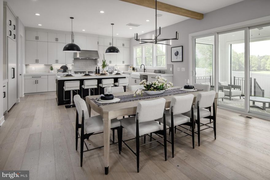 Welcome to The Grove at Dominion Hills, an exclusive Toll Brothers community nestled in the heart of highly sought-after Arlington, VA. Presenting the stunning Rouse home design, this brand-new residence is now available for a Spring 2025 move-in, crafted to elevate your lifestyle. Step through the front door into a bright, airy foyer featuring soaring 10-foot ceilings. To the right, a spacious office provides the perfect setting for productivity, complemented by a convenient powder room nearby. Your journey continues into the heart of the home—the fully upgraded kitchen, adorned with elegant soft-close cabinetry that reaches the ceiling, striking countertops, and high-end stainless-steel Jenn Air appliances. Just off the kitchen, an everyday entry with a drop zone and hall closet offers practical storage solutions, seamlessly leading to the two-car garage. Unwind in the inviting great room, complete with a cozy gas fireplace, and extend your living space to the luxury outdoor area, ideal for both morning coffee and evening gatherings. This exquisite outdoor living space features a multi-slide stacked door that merges indoor and outdoor living, enhanced by retractable screens for added comfort. The upper level boasts a spacious primary suite, complete with dual walk-in closets and a serene primary bath featuring separate vanities, a large soaking tub, and a dual-sided walk-in semi-frameless shower. Three additional generously sized bedrooms, each with walk-in closets, are complemented by two well-appointed full baths. A dedicated laundry room equipped with cabinetry and a utility sink adds to the convenience. An additional staircase leads to a finished third-floor walk-up space, offering approximately 560+ sq. ft. of versatile living area, complete with a storage closet and full bath—perfect for guests, a playroom, or a private retreat. The finished lower level invites entertainment with a spacious rec room, a wet bar, an additional bedroom, a full bath, and ample storage. Nestled on a tranquil cul-de-sac, this exceptional home is ideally located near major commuter routes, the East Falls Church Metro Station, local parks, shopping, dining, and more. Don’t miss your opportunity to call this extraordinary residence your own—contact us today to schedule a private tour! Model Closed on Tuesday & Wednesdays.