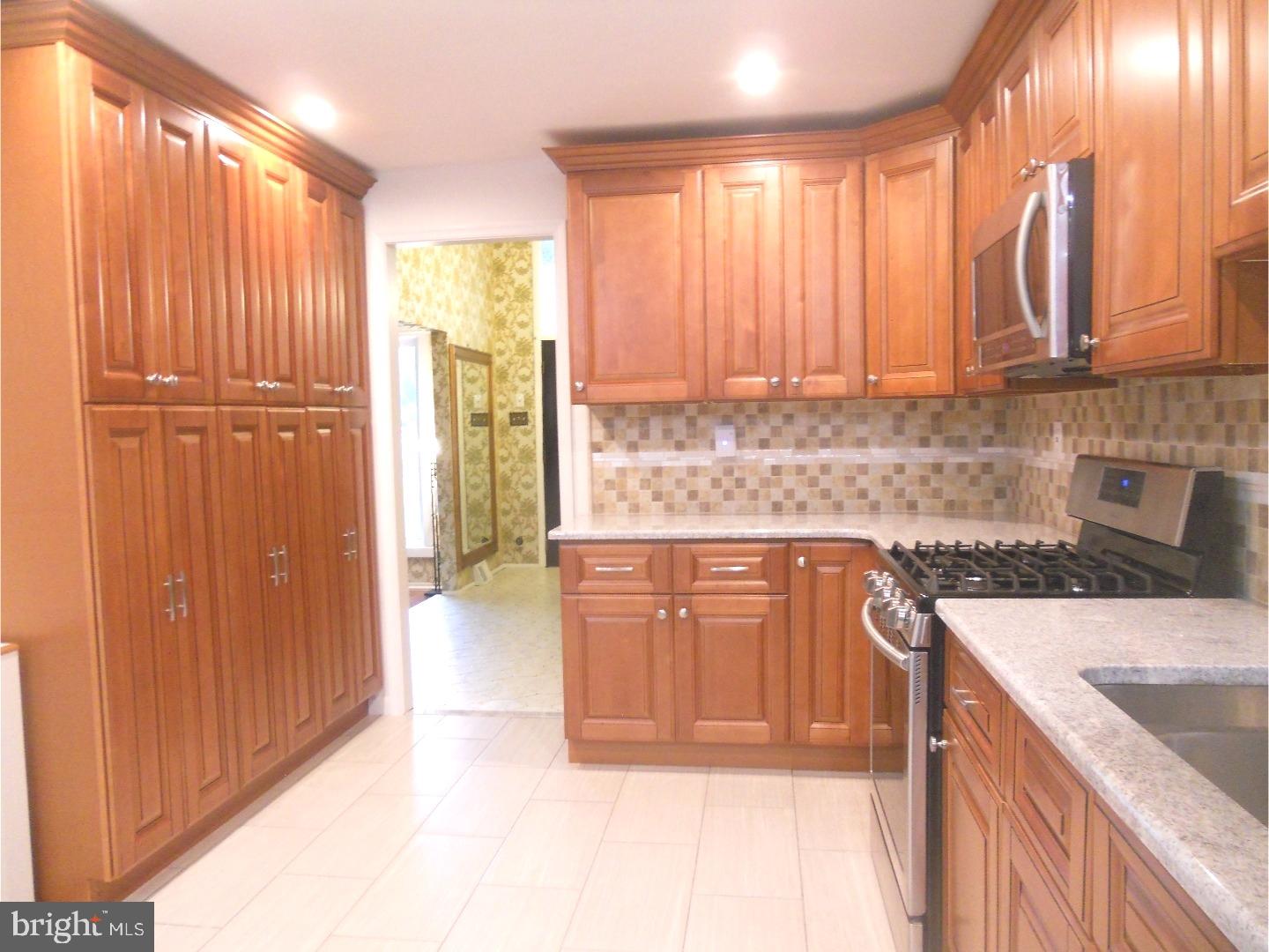 Beautiful home on a corner lot that has been updated is available in Albidale in the much sought after Lower Moreland School district.  This home offers a formal Living Room with its large picture window, a vaulted ceiling and is open to the Dining Room.  The brand new eat-in kitchen was just completed with lots of cabinets, tiled backsplash, new stove, new dishwasher, granite countertops and the breakfast area has a vaulted ceiling, windows all around with views to the beautiful backyard. This home was just updated with the following: New Roof, new master bathroom, new hallway bathroom with double vanity, new powder room, basement was just redone, new flooring throughout, new a/c & heat, new hot water heater, and the interiors were freshly painted.  This home also features a sunroom, family room with fireplace, laundry room, fenced-in yard and 2 car garage.  Walk to the park and playground, conveniently located near transportation and major highways.