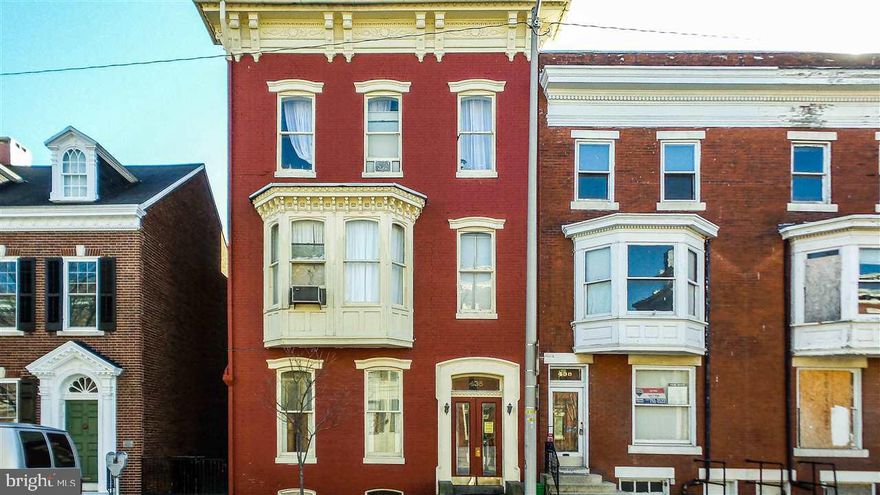 Large solid 3 unit built with amazing charm & character - massive stained railings, high ceilings, ceiling medallions & crown moldings, 3 sep new furnaces. # new water heaters, sep gas & elec meters. Stable tenants. Parking for 8 cars off street! Fenced courtyard would be great owner occupied too! Newer rubber roof on main roof too!