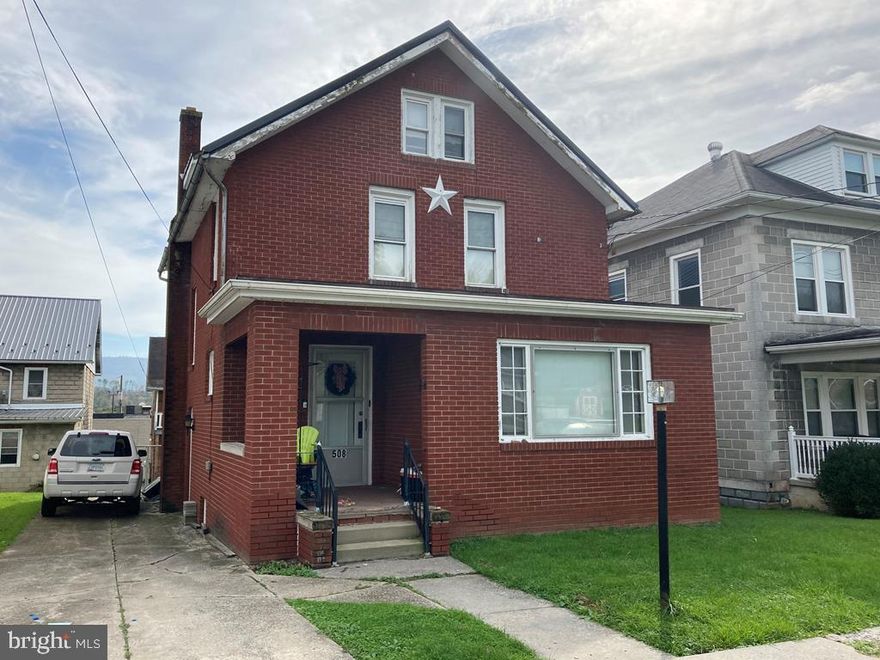 Brick 2 story home with 3 bedrooms and 2 baths. some thermopane windows, newer metal roof on the house. 3 car detached garage with a 2 bedroom apartment above; nice location. Front house is vacant. Rear apartment pays $400. Tenant covers all utilities.