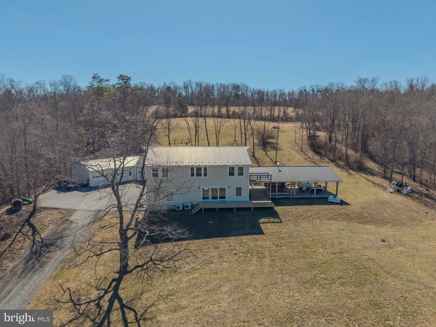 This property is going to onsite auction 5/2/2026 at 11:00 AM and is being sold with reserve. LISTED PRICE IS ONLY A SUGGESTED OPENING BID AND IS NOT INDICATIVE OF THE FINAL SALES PRICE WHICH WILL BE BY SELLER CONFIRMATION DAY OF AUCTION. Terms: Down payment of $30,000 required day of auction. Settlement on or before 7/2/2026. Transfer taxes to be paid by buyer. Real Estate taxes shall be prorated......
This secluded 32.69-acre property offers an exceptional blend of privacy, recreation, and country living. The land features a stream tributary to Buffalo Creek flowing through the property, approximately one acre of open ground, and the balance wooded with scenic hollows, ridges, and trails. 

The 2,800 sq ft home includes 4 bedrooms and 2.5 baths and was totally rebuilt with a second floor added in 2011, along with an Everlast metal roof and low-maintenance Hardie Board siding. Inside you’ll find an open floor plan featuring reclaimed lumber and flooring from an antique bank barn, along with wood cut from this property, giving the home distinctive character and many unique features. The spacious kitchen includes a six-burner propane stove, side-by-side refrigerator/freezer, and a three-bay sink, and is open to the living area where large picture windows bring in natural light and showcase the surrounding views.

Outdoor living is a highlight with the impressive 40' × 47' covered deck—an ideal place for family gatherings while enjoying the surrounding woods with its deer, turkey and occasional bear. A front deck was added in 2025. Heating is provided by an outdoor wood furnace located adjacent to a 10' × 24' wood shed, with backup heat supplied by a 500-gallon propane tank plus mini-splits.

Additional improvements include a 4-car garage (finished in 2021) with ample storage and a heated, insulated section that offers potential for in-law quarters or a recreation room. A 23' × 45' two-story barn provides excellent space for workshop projects and storage. A 16' × 24' cabin tucked in the woods once served as camp staff headquarters, reflecting the property’s history as part Longacre Expeditions. Because of its former campground use, the septic system and well were designed to accommodate up to 75 people. The woodlot was selectively cut in 2006 and now shows mature timber. Adjoining farm fields create excellent wildlife habitat, making this a prime hunting and outdoor recreation property.

Conveniently located just off Middle Ridge and less than 5 miles from Little Buffalo State Park, this property offers a special place to gather with family and friends while enjoying the peace, privacy, and outdoor lifestyle this area is known for.