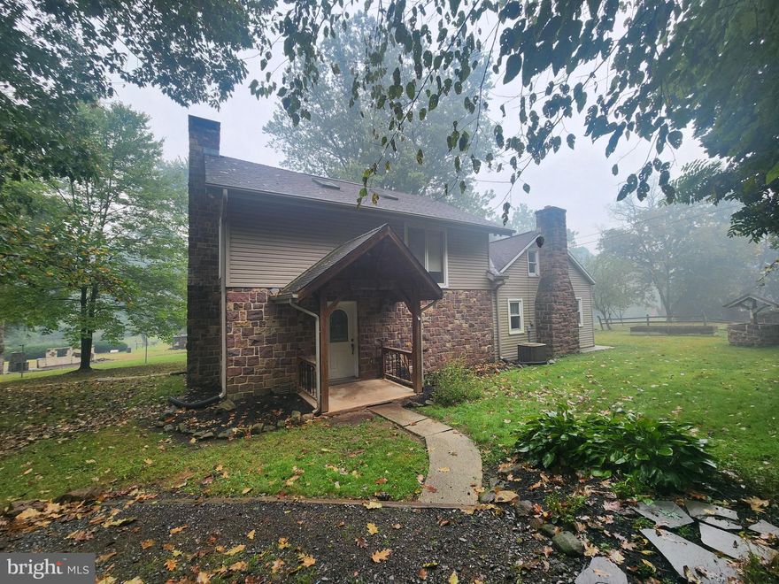 This property will be offered at Public Auction on Saturday, November 8, 2025 @ 12pm.  The listing price is the opening bid only and in no way reflects the final sale price.  10% down due at auction, 2% transfer tax to be paid by the purchaser, real estate taxes prorated. This secluded 4.90 acre property, 
situated on a private road, offers a three bedroom home, a 21’x37’ barn with an overhead garage door, a fenced in pasture with an animal shelter and a pond. The main floor of the home hosts an open kitchen & dining area with exposed beams and a stone fireplace, a spacious family room with a wood stove and built-in bookcases as well as a full bathroom, laundry room, and mudroom. The second floor features three bedrooms, an open loft area, and a full bathroom. Additional amenities include 
direct access to Shearer’s Creek at the rear of the property, convenient proximity to Routes 76, 72, and 322, and a newly installed (September 2025) sand mound septic system for a four-bedroom home.