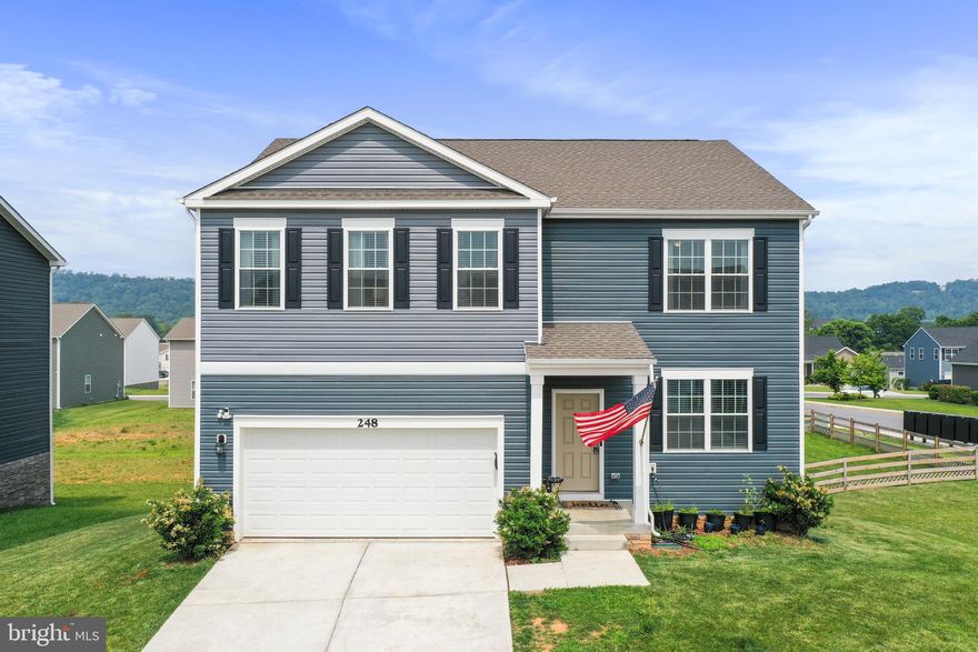 Come home to the quiet community of Red Hill which is one of the friendliest neighborhoods you'll ever visit. Stroll through the community and you'll be greeted by neighbors who are out enjoying the sunshine. One convenience of living in Red Hill is that there are multiple ways to access the neighborhood.  It is also close to the local schools. You'll love the open floor plan on the main level. The kitchen features white cabinets with black handles, stainless steel appliances, granite countertops, an island with pendant lighting, gas cooking & a pantry. There is a bedroom & full bath on the main level.  The primary suite features a walk-in closet, dual sinks & a commode enclosure. There are 3 additional bedrooms upstairs plus a loft & the laundry room. The partially finished basement offers a spacious recreation room, rough-in plumbing for a future bathroom, space for a future 6th bedroom & plenty of storage. The corner lot is nice because you only have a neighbor on one side. The backyard is fenced and ready for romping. The mailbox cluster is a short walk across the lawn.