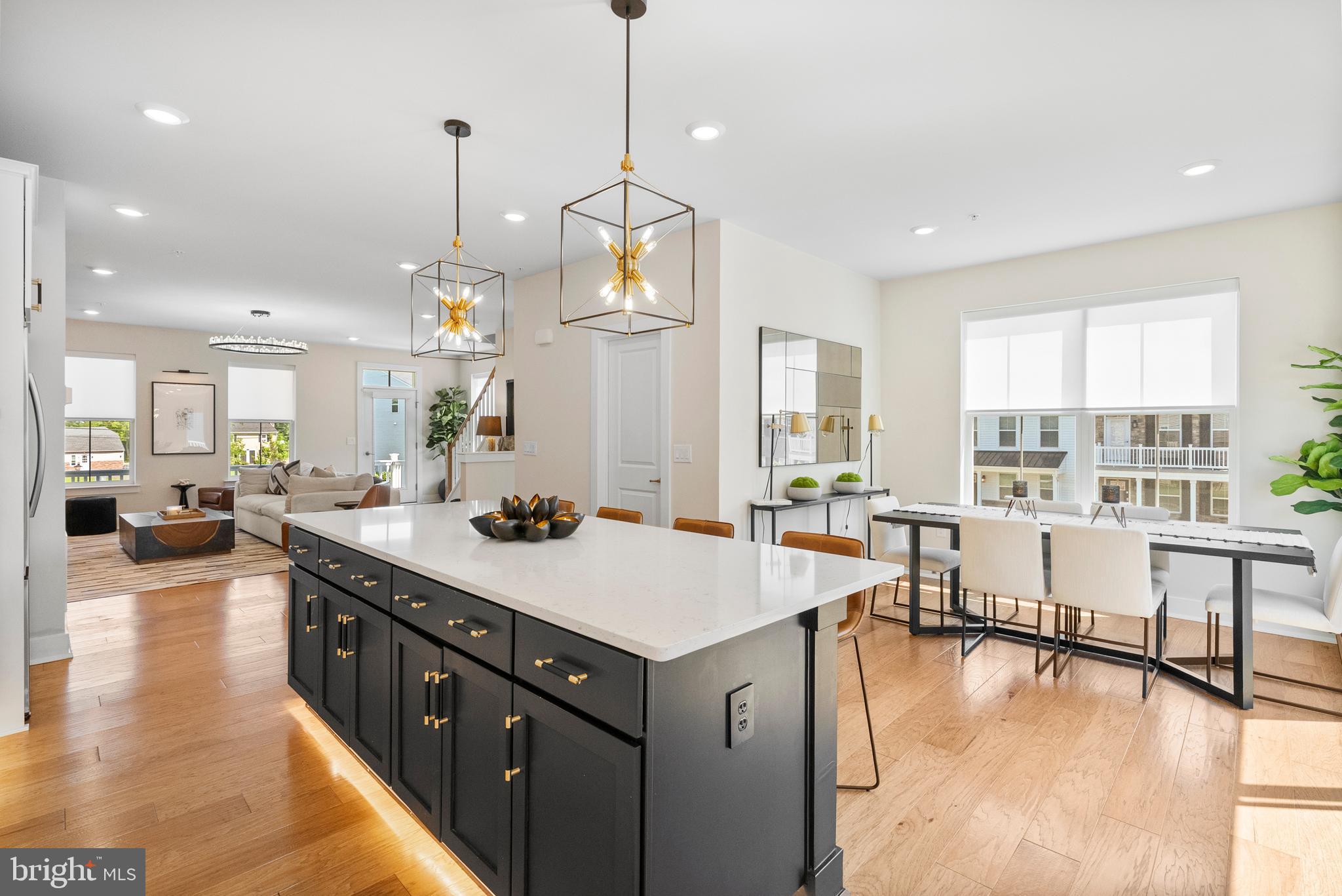 Designer-Owned end unit townhome in the popular Lantern Ridge Community. THIS HOME SHOWS BETTER THAN THE MODEL!! Endless high-end upgrades throughout!! Welcome to the pinnacle of style and sophistication in the heart of the highly sought-after Central Bucks School District. This stunning end-unit townhome, owned by a professional designer, exudes style in every detail – offering 3 spacious bedrooms, 2 full baths, and 2 elegant half baths across a thoughtfully designed layout that seamlessly blends comfort and care free living. Step inside and prepare to be impressed by the chef’s dream kitchen, where stainless appliances, 42" white cabinetry, designer lighting, and quartz countertops elevate everyday cooking to a culinary experience. Every inch of this residence has been lavishly upgraded, featuring hand-selected finishes, elegant lighting, high-end fixtures and hardware, and a show-stopping custom fireplace with shelving and accent lighting. All create an atmosphere of timeless elegance. With abundant natural light, 9' ceilings, 2nd floor laundry, and refined touches throughout, this home is as beautiful as it is functional. The primary suite offers a true retreat with tray ceiling, ensuite bath and walk-in closet with custom organization system. Two additional bedrooms provide flexibility for guests, a home office, or growing families. For your relaxation and outdoor comfort, this home offers front and rear patios and a 2nd level deck overlooking open space with a gazebo and mature trees. Additional features include custom window treatments throughout, a two car garage, and ring alarm system. Just minutes from downtown Doylestown for dining, shopping, or cultural events as well as Peace Valley and Nockamixon Parks for nature enthusiasts. Be the envy of your friends and family by owning this special home! Schedule your private showing today and experience the perfect blend of luxury, location, and lifestyle!