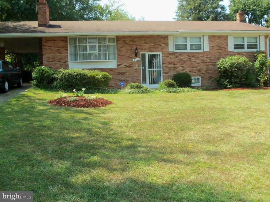 Fully Available--Beautiful brick split foyer-main level new hardwood floors**spacious living room/FP and formal dining room**eat-in kitchen, new cabinets and stainless steel appliances**master suite, two additional bedrooms and second bath**lower level is self contained unit w/family room, fireplace, 2nd kitchen, additional two BRs, updated bath**CAC**carport, OSP for 6 cars**huge yard.