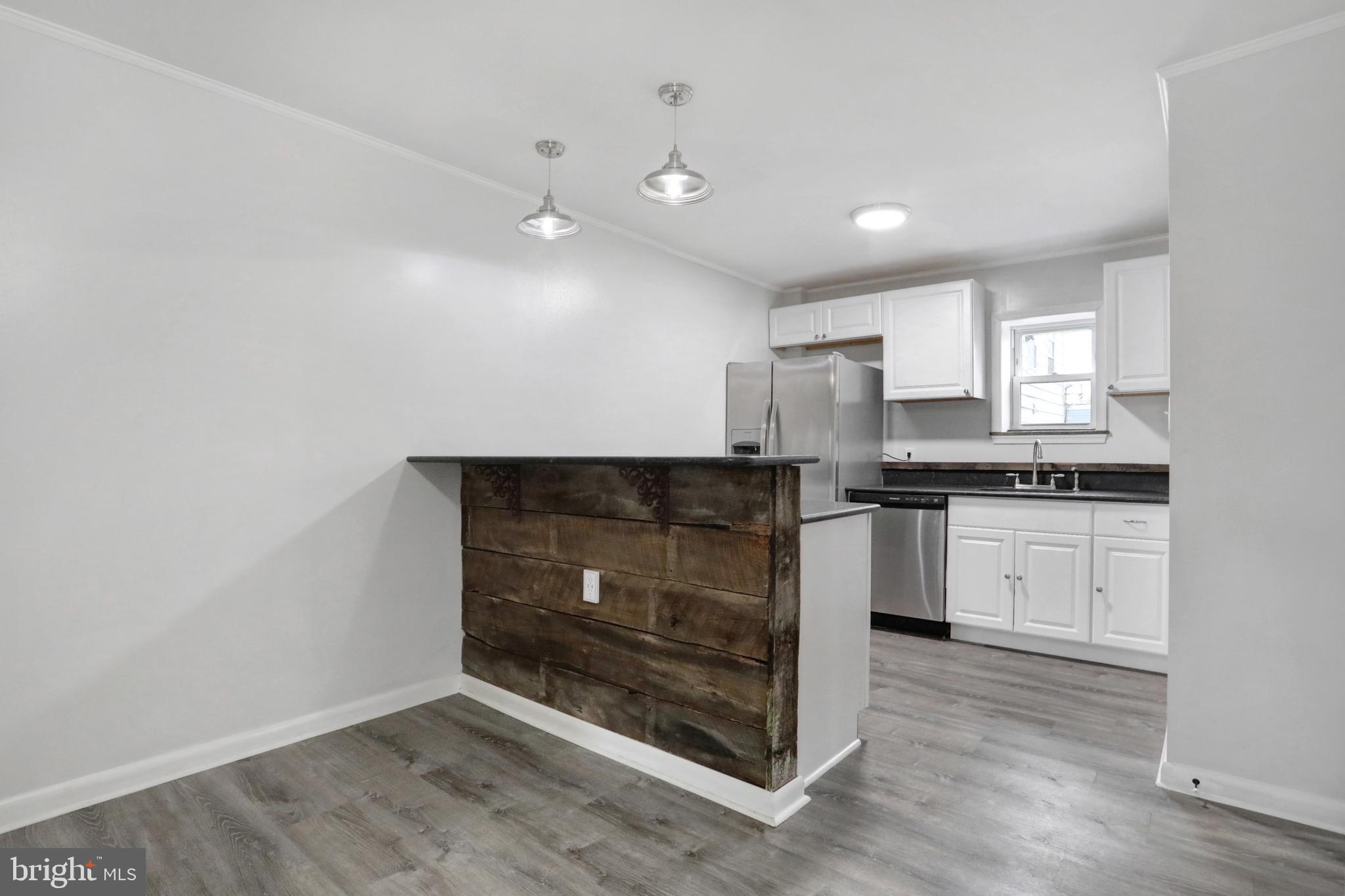 Entirely renovated apartments for rent. Kitchen features reclaimed wood island and granite counters. Large living room with decorative fireplace and new light fixtures. Excellent location, one block from Historic District, shopping and restaurants. Rent includes two assigned parking spaces. Washer and dryer in unit