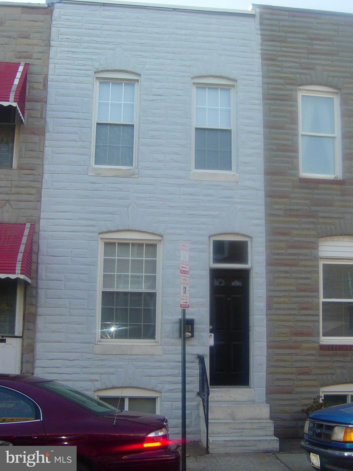 Beautiful newly renovated 2 Bedroom,1 Bath +(Flush in Bsmt)townhouse just blocks from Canton Square with Parking Pad! Exposed brick thru-out.Custom kitchen w/plenty of storage,Quartz counter & breakfast bar,upgraded appliances.Quartz bathroom vanity in completely new bathroom rehab. Light & bright w/ 2 skylights.Upstairs middle room for office.Stand up Bsmt w/plenty of storage! Seller Motivated..