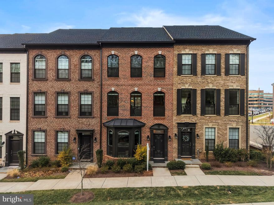 New Year, New Home!  Built in 2022, this home offers an exceptional blend of premium upgrades and thoughtful design, highlighted by an open floor plan with the gourmet kitchen at the center of it all. The kitchen features an oversized island with a cabinetry-wrapped range hood, five-burner gas cooktop, built-in microwave, granite countertops, and double wall ovens, and flows seamlessly into the spacious family room anchored by a striking 70-inch Allusion Platinum electric fireplace, along with a convenient office nook and designated dining space. Upstairs, the generous owner’s suite includes an expansive bathroom and large walk-in closet, complemented by two additional bedrooms that share a hall bath, an upper-level laundry room, and new carpet throughout the level. The lower level offers another bedroom, a full bath, and direct access to the two-car garage. Additional highlights include upgraded hardwood flooring, oak stair treads with white risers, and Craftsman-style railings. Ideally located in the heart of Fair Lakes with close proximity to Whole Foods, Target, Walmart, Best Buy, Costco, Fairfax Corner, and a variety of dining options, plus easy access to Fairfax County Parkway and I-66, this is a rare opportunity in a highly sought-after location.  Don't miss out!