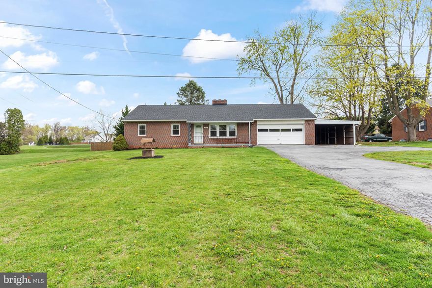 Nicely updated all-brick rancher in a great location.  The home features hardwood flooring, new kitchen cabinets with granite countertops and stainless-steel appliances, fully finished basement, 2 car attached garage and carport.  The main floor has 3 bedrooms, 1.5 bathrooms, large family room with fireplace, new kitchen with eat-in area, laundry room/mud room, and 3 season room.  The lower level has a huge finished family room with fireplace and new flooring.  The entire house has been freshly painted, new electric panel, newer heat pump, new gutters and downspouts.  The roof and windows were installed in 2016 and the septic was installed in 2018.  There is also a backup propane boiler for the cold winter months.  This is a must see!!