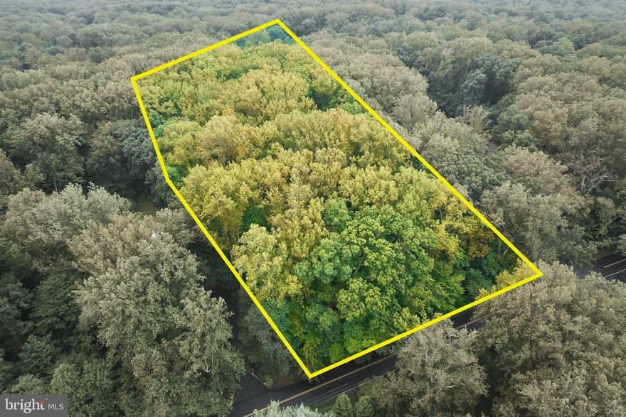 Nestled within a serene landscape, this expansive approximately 3-acre lot offers a unique opportunity to create your dream retreat surrounded by nature's beauty. Enveloped by lush trees and wooded areas, this property provides a tranquil escape from the hustle and bustle of everyday life, inviting you to immerse yourself in the soothing sounds of nature. Imagine waking up to the gentle rustle of leaves and the soft chirping of birds, all while enjoying the privacy and seclusion that this remarkable lot affords. The natural surroundings not only enhance the aesthetic appeal but also create a peaceful ambiance that is perfect for relaxation and rejuvenation. The lot's generous size allows for endless possibilities, whether you envision a luxurious estate, a charming cottage, or a modern masterpiece. The wooded backdrop offers a picturesque setting that can be tailored to your personal style, ensuring that your home will be a true reflection of your vision. With the potential for stunning views of the surrounding trees and woods, this property is a canvas for your imagination. Picture expansive windows that frame the beauty of the outdoors, allowing natural light to flood your living spaces and creating a seamless connection between indoor and outdoor living. This exclusive lifestyle is not just about the land; it's about the experience of living in harmony with nature. The peaceful environment encourages outdoor activities, from leisurely strolls through the woods to serene moments spent enjoying the sunset from your future porch. Seize the opportunity to build a sanctuary that embodies luxury and comfort, where every detail is designed to enhance your quality of life. This lot is more than just a piece of land; it's a gateway to a lifestyle defined by tranquility, beauty, and the joy of creating a home that is uniquely yours. Embrace the chance to cultivate a life surrounded by nature, where every day feels like a retreat. This is your opportunity to invest in a property that promises not just a home, but a lifestyle of peace and elegance.  Excellent location and schools!  A Rare Find!