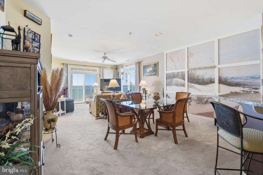 Welcome to a truly one-of-a-kind penthouse in Crisfield, MD, where breathtaking water views surround you in every direction. This top-floor, west-facing residence features a massive wrap-around balcony with panoramic vistas of the Chesapeake Bay and Tangier Sound as they merge—views you simply have to see to believe. The front balcony overlooks the peaceful Summers Cove off the Annemessex River.  Both balconies offer breathtaking sunsets. This 3-bedroom, 2-full-bath home offers comfortable coastal living with a ceramic tile entry foyer, an updated kitchen featuring granite countertops, stainless steel appliances, a new microwave and ceramic tile floor.  Upgraded wall to wall carpet and upgraded padding throughout. Other features include a cozy, electric fireplace in the living room, electric shades in primary bedroom, a full-size washer and dryer, a garage storage shed, a new HVAC, and a private boat slip that comes with this unit. There is uncovered parking out front and covered garage parking out back. Tangier Sound Condominium has access to a pool through membership at Somers Cover Marina for a fee that is just a scenic half-mile walk away. The open layout of this condominium maximizes natural light and showcases the incredible water views from nearly every room. Furniture can convey making this an ideal turnkey primary residence, second home, or waterfront retreat. You have never seen water views like this—must see to fully appreciate!