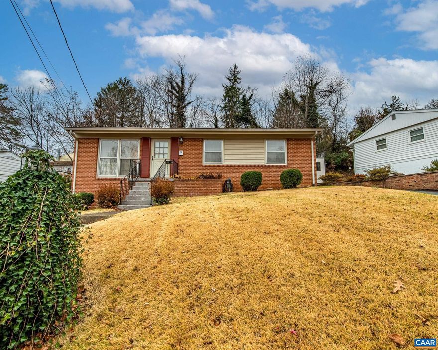 Well-loved and owned by the same family for generations, this Brick Ranch Home features 3 Bedrooms 1.5 Baths & Real Hardwood Floors on main level. Eat-in Kitchen w Sliding doors to Big Sitting Deck & wooded view. Skylight in Full Bath & primary suite w/ half bath. The partial walk out basement with bonus room, laundry & utilities. The ideal Charlottesville location and elevated lot make this solid potential for updates and great opportunity to bring new life to a cherished home at an attractive price! New Gas Range & Fridge. Lush Lawn w/ Brick Retaining Wall along Paved Private Driveway. The exterior Sewer Line was Replaced 2015, Gas Furnace & A/C 2007, Water Heater 2007 & Roof 2010. Come see this hidden gem before the Holidays!,Formica Counter,Wood Cabinets