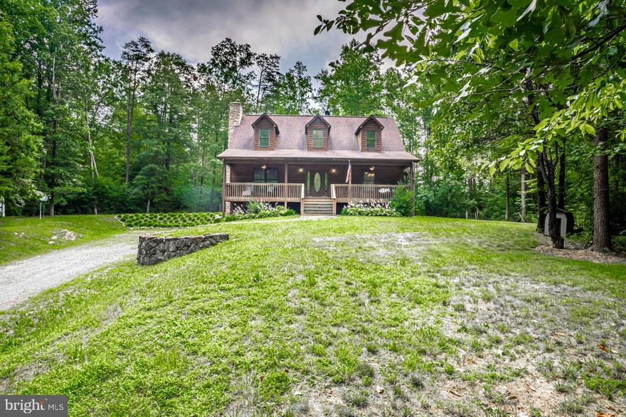 Incredible Opportunity to Own a Piece of Paradise.  This Cedar Home was built by Mennonites with all the Privacy you could ever ask for!  6.83 Secluded Acres Surrounded by Trees at the end of Hidden Lake Ln.  The Home Features and Open Floor Plan with Gleaming Hardwood Floors throughout except for the Bedrooms.  The Upper Level Features An Inviting Primary Bedroom with Walk-in Closet and Extra Storage.  The Primary Bath features a Jetted Soaking Tub and Separate Shower.  The Unfinished Basement is Walkout-Level and has a Rough-in for a Bathroom.  Lots of Natural Light from the Large Windows.  It is just waiting for Your Personal Touch for Additional Living Space, Media Room, Workshop, Bedroom, etc.  The Main Level has an Open Floor Plan with Cathedral Ceilings and a Stone Fireplace. Picture Yourself Sitting on the Front Porch Watching the Sunset.  This Home is Move-in Ready!