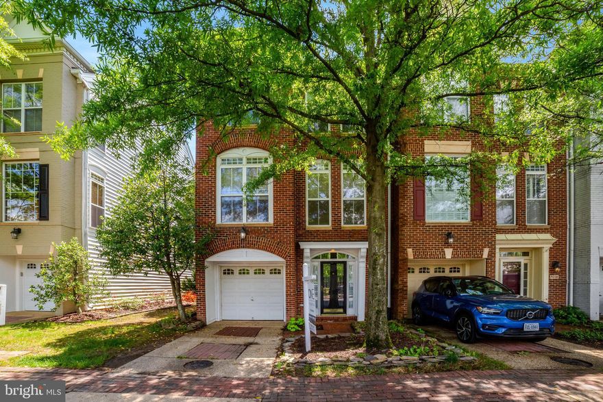 Welcome home to the desirable community of Cameron Station! Conveniently located just off of Duke Street, this welcoming and freshly-painted three-level townhome offers a spacious, light-filled layout ideal for both everyday living and entertaining. On the main level, gleaming hardwood floors flow seamlessly throughout the elegant living and dining rooms, where floor to ceiling windows flood the home with natural light. On the back of the home, the expansive eat-in kitchen boasts a double wall oven, an island bar, tasteful tile backsplash, and separate pantry. Enjoy casual meals in the spacious breakfast nook, or step out onto the wooden deck just off the kitchen for effortless grilling and outdoor dining all Summer long. Upstairs, the primary bedroom suite features a dramatic vaulted ceiling, plush carpeting, and a large walk-in closet. Inside the en suite bathroom you’ll find two separate vanities and  corner soaking tub as well as a step-in shower. Both additional bedrooms include soft carpeted floors, high ceilings, and wide closets, with shared access to the second full bathroom in the hallway. Laundry is located on the bedroom level for the height of convenience! Downstairs on the entry level, the cozy recreation room offers a flexible bonus space with a gas fireplace and recessed lighting. Walk outside into your fenced backyard, surrounded by trees for both privacy and shade as you play or relax. From this level, you’ll also have access to your one-car garage and driveway, providing you with plenty of space for convenient storage and parking. The charming community of Cameron Station offers an abundance of amenities, including an on-site fitness center, outdoor pool, playground, basketball and tennis courts, and beautiful common grounds including trails, water access, and a picnic area. This mixed-use neighborhood also offers the convenience of a daycare, coffee shop, dry cleaners, dentist, and more located along the center of the community, plus the popular West End Farmers Market and Ben Brenman Park. Just minutes to Harris Teeter, Aldi,  Old Town Alexandria, Kingstowne, Pentagon City, Amazon HQ2, The Pentagon, and the new WestEnd development with Inova Alexandria Hospital. Quick access to I-395, I-495, Van Dorn Street, King Street, and Route 1, plus shuttle service to the nearby Van Dorn Metro Station for easy commuting. Schedule a private tour of your beautiful new home today!