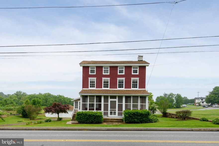 Welcome to 808 W. Baltimore Pike in West Grove, Pennsylvania a charming turn-of-the-century solid brick residence ideally situated in Jennersville Village and adjacent to the historic Red Rose Inn. Rich in character and timeless appeal, this spacious home offers classic architectural details, generous living space, and the opportunity to blend historic charm with modern updates. A screened front porch welcomes you into the traditional center hall layout, flanked by a formal living room and formal dining room, both offering the warmth and character expected from a home of this era. Toward the rear of the home, the country kitchen features vintage metal cabinetry in remarkably good condition, a wide double-bowl ceramic sink, old-fashioned electric range, and a desirable walk-in pantry that provides excellent storage and functionality. A cozy first-floor den and additional closet/storage areas add flexibility for everyday living. The second floor offers three nicely sized bedrooms and a full hall bath ready for your personal updating touches. The third floor expands the living space even further with three additional bedrooms highlighted by random-width pine flooring, a wide central hallway, and generous closet space ideal for larger households, guest accommodations, hobby rooms, or home office use. The unfinished basement is exceptionally clean and houses the home’s mechanical systems, including oil-fired hot water radiator heat, electric hot water heater, and an updated 200-amp electrical service with circuit breakers. The property is currently serviced by on-site well and septic/cesspool systems, with public water and sewer available nearby for future connection possibilities. Conveniently located along the Baltimore Pike corridor, this property offers easy access to shopping, dining, schools, and commuter routes while maintaining the charm and history associated with the West Grove and Jennersville area. A rare opportunity to own a substantial brick home with timeless character in a highly convenient Southern Chester County location.