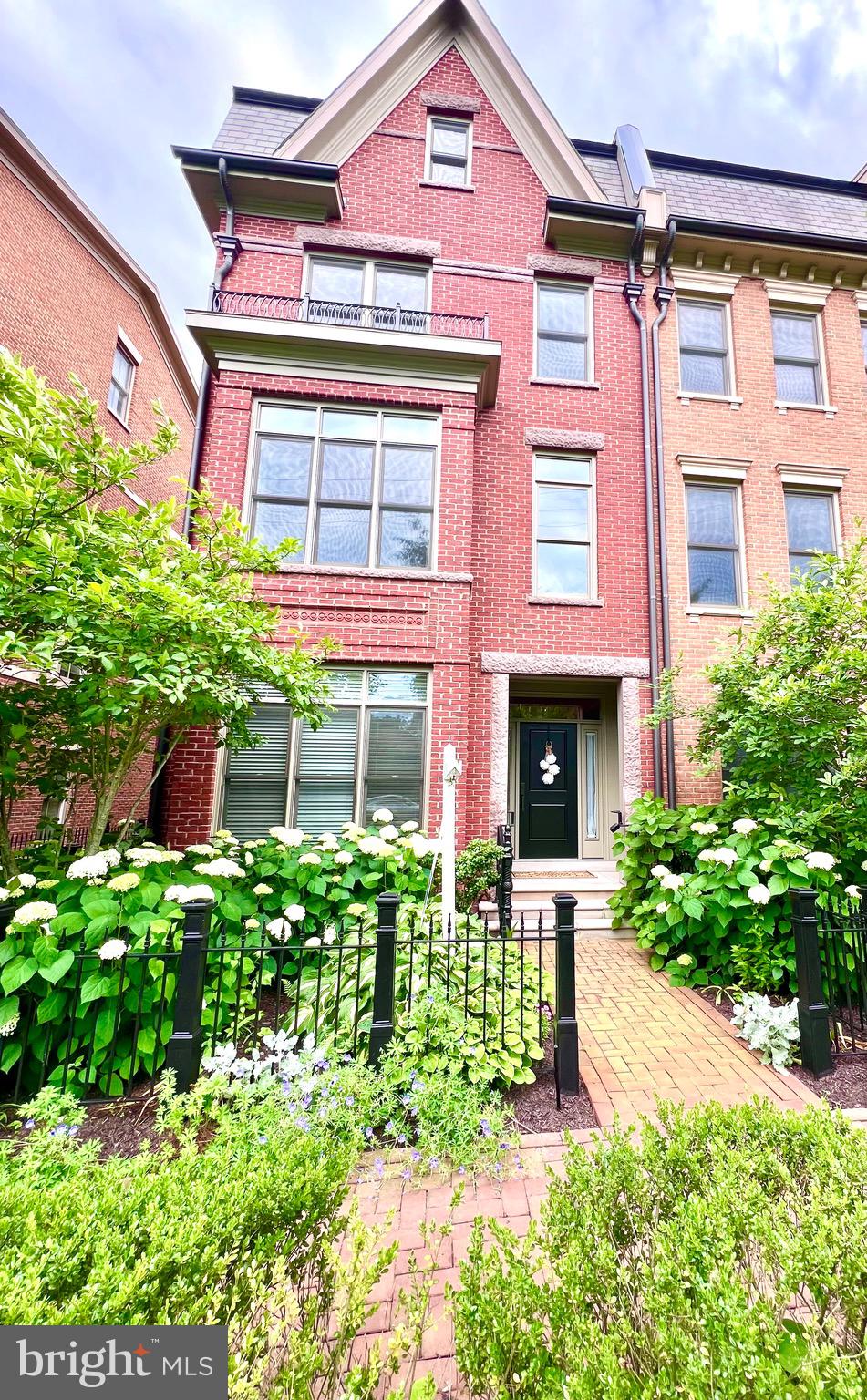 Welcome to this Gorgeous Brownstone ,located in Symphony Park at Strathmore.
This luxurious townhome community in North Bethesda offers a convenient location while providing a serene and tranquil setting. As you step inside, you'll be greeted by the elegance of hardwood floors that flow throughout the main living spaces, stunning millwork including crown molding throughout, and an elevator giving access to all four levels of the home. The entry level boasts a welcoming foyer, a bedroom with an ensuite bathroom, an office/library, and convenient access to the attached two-car garage, ensuring ease and comfort. The main level gourmet kitchen is a chef's dream, featuring a center island, high-end stainless steel appliances including a Viking six-burner gas range/oven with a hood, separate wall oven and microwave, refrigerator/freezer, and dishwasher. The ample cabinetry, marble countertops, and tile backsplash create a functional and stylish space. The kitchen seamlessly opens up to the attached family room, which features a gas fireplace, custom built-ins, and access to the deck. The sun-filled combination dining room and formal living room offer an ideal entertaining space. Completing this level is a convenient powder bathroom. Venture up to the third level, where you'll find two bedrooms, each with its own ensuite bathroom and the conveniently located laundry. The primary suite is a true oasis, boasting a spacious walk-in closet and a spa-like ensuite bathroom with a soaking tub, separate shower, and dual vanity. The fourth floor is a true entertainer's delight, featuring a stunning entertainment space with a full wet bar and an enormous outdoor rooftop terrace, perfect for hosting gatherings and enjoying the beautiful views. Additionally, there is a fourth bedroom with an ensuite bathroom, providing flexibility and versatility. This exceptional home is ideally located adjacent to the Strathmore Symphony Hall, and with Metro only a short distance away, commuting is a breeze. You'll also appreciate the close proximity to Pike & Rose, Whole Foods, Harris Teeter, Giant, Balducci's, and Downtown Bethesda, offering a wide array of shopping, dining, and entertainment options.