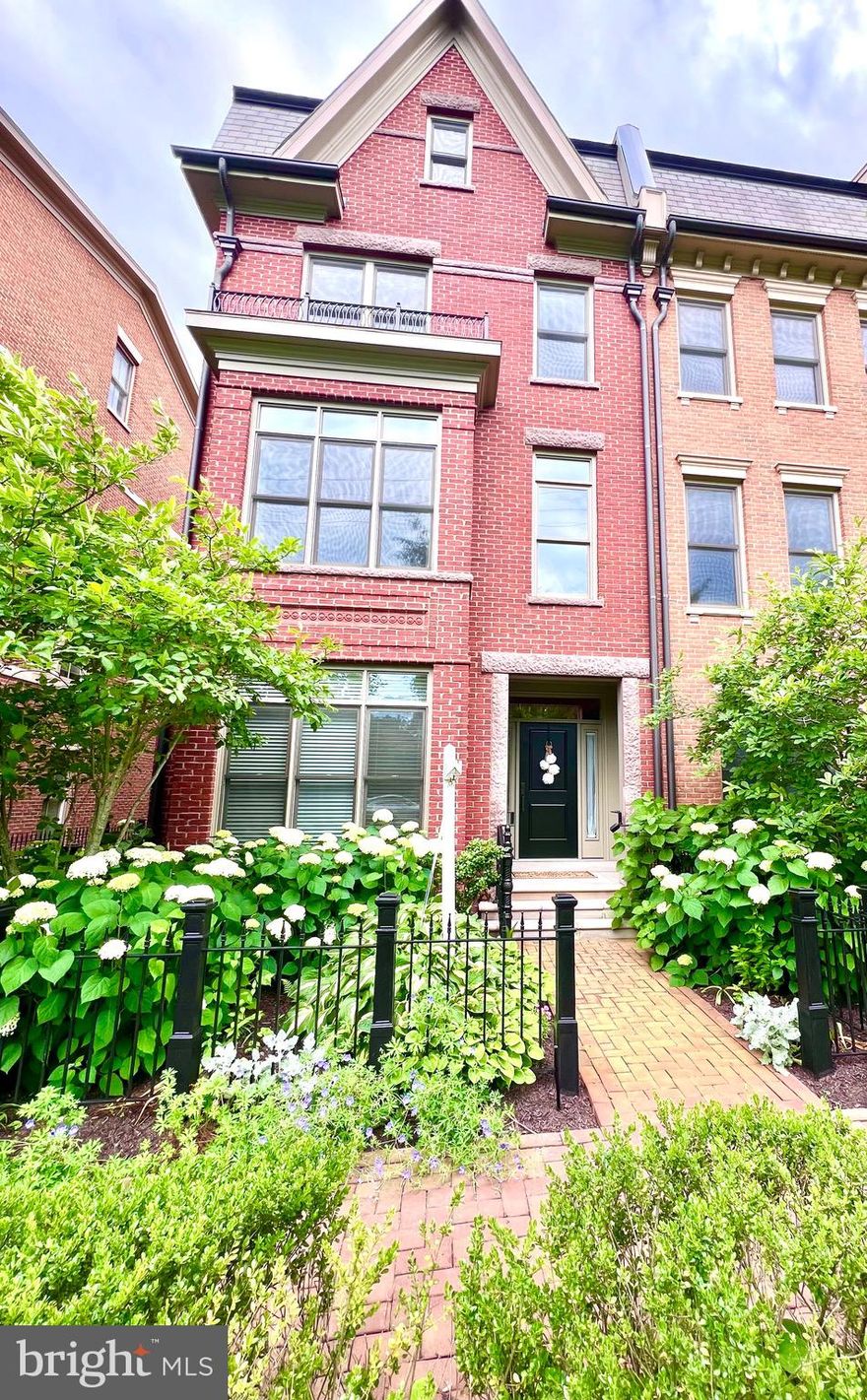 Welcome to this Gorgeous Brownstone ,located in Symphony Park at Strathmore. 
This luxurious townhome community in North Bethesda offers a convenient location while providing a serene and tranquil setting. As you step inside, you'll be greeted by the elegance of hardwood floors that flow throughout the main living spaces, stunning millwork including crown molding throughout, and an elevator giving access to all four levels of the home. The entry level boasts a welcoming foyer, a bedroom with an ensuite bathroom, an office/library, and convenient access to the attached two-car garage, ensuring ease and comfort. The main level gourmet kitchen is a chef's dream, featuring a center island, high-end stainless steel appliances including a Viking six-burner gas range/oven with a hood, separate wall oven and microwave, refrigerator/freezer, and dishwasher. The ample cabinetry, marble  countertops, and tile backsplash create a functional and stylish space. The kitchen seamlessly opens up to the attached family room, which features a gas fireplace, custom built-ins, and access to the deck. The sun-filled combination dining room and formal living room offer an ideal entertaining space. Completing this level is a convenient powder bathroom. Venture up to the third level, where you'll find two bedrooms, each with its own ensuite bathroom and the conveniently located laundry. The primary suite is a true oasis, boasting a spacious walk-in closet and a spa-like ensuite bathroom with a soaking tub, separate shower, and dual vanity. The fourth floor is a true entertainer's delight, featuring a stunning entertainment space with a full wet bar and an enormous outdoor rooftop terrace, perfect for hosting gatherings and enjoying the beautiful views. Additionally, there is a fourth bedroom with an ensuite bathroom, providing flexibility and versatility. This exceptional home is ideally located adjacent to the Strathmore Symphony Hall, and with Metro only a short distance away, commuting is a breeze. You'll also appreciate the close proximity to Pike & Rose, Whole Foods, Harris Teeter, Giant, Balducci's, and Downtown Bethesda, offering a wide array of shopping, dining, and entertainment options.